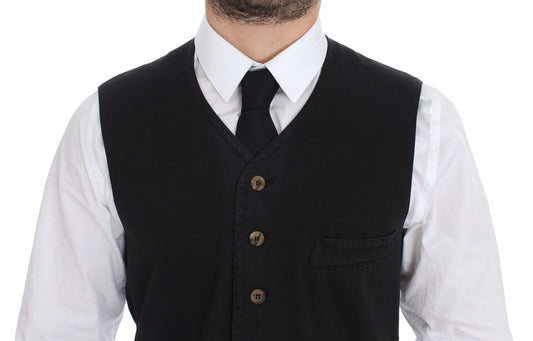 A black vest with a white shirt underneath, featuring a collar and buttons