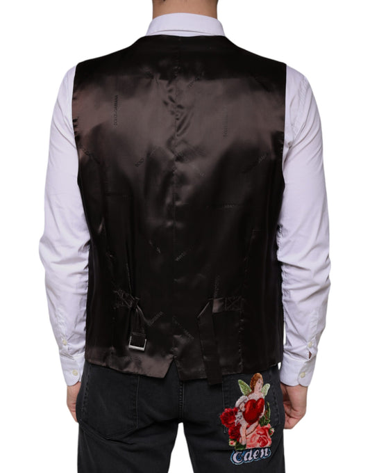 A black cotton waistcoat with a floral embroidered patch on the back