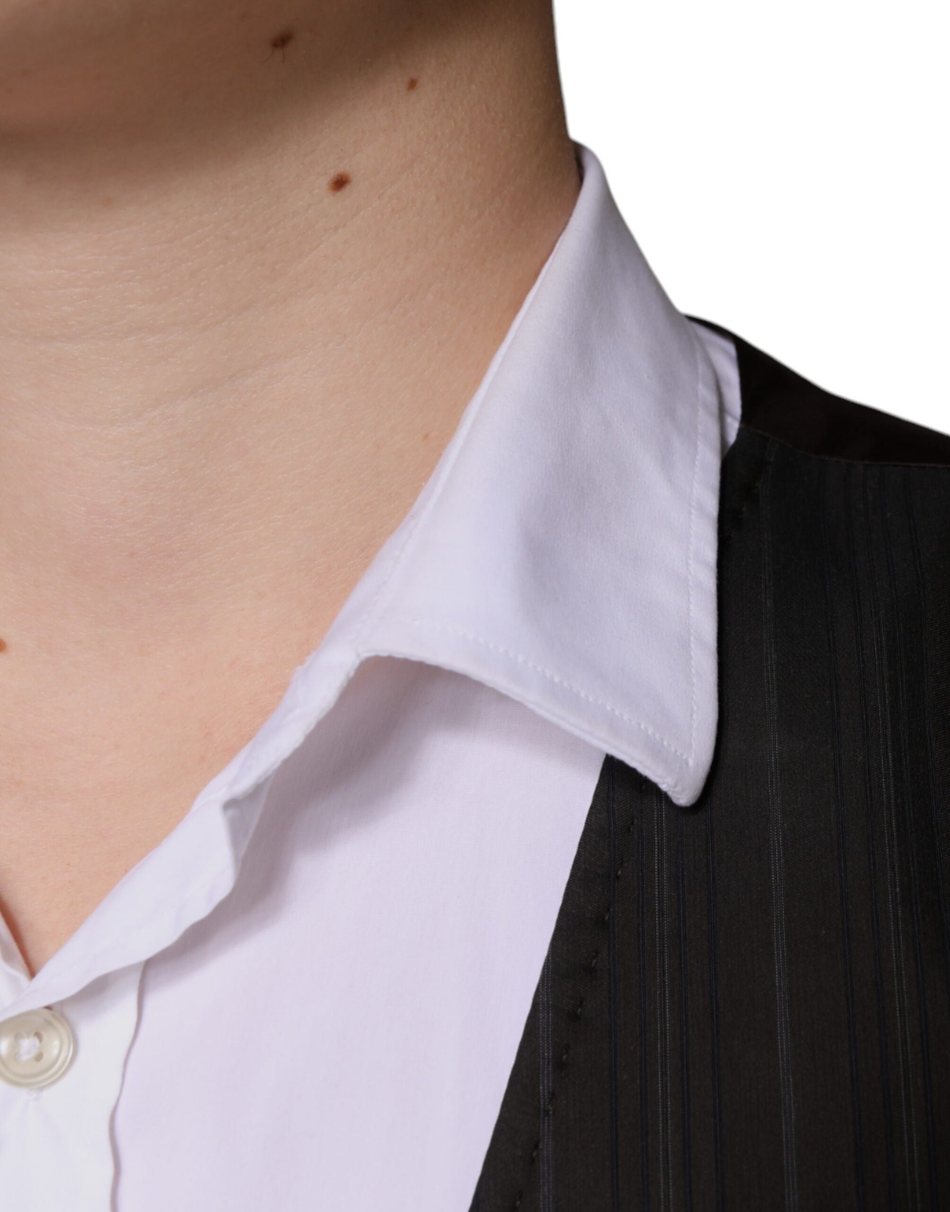 A black cotton waistcoat with a white shirt collar