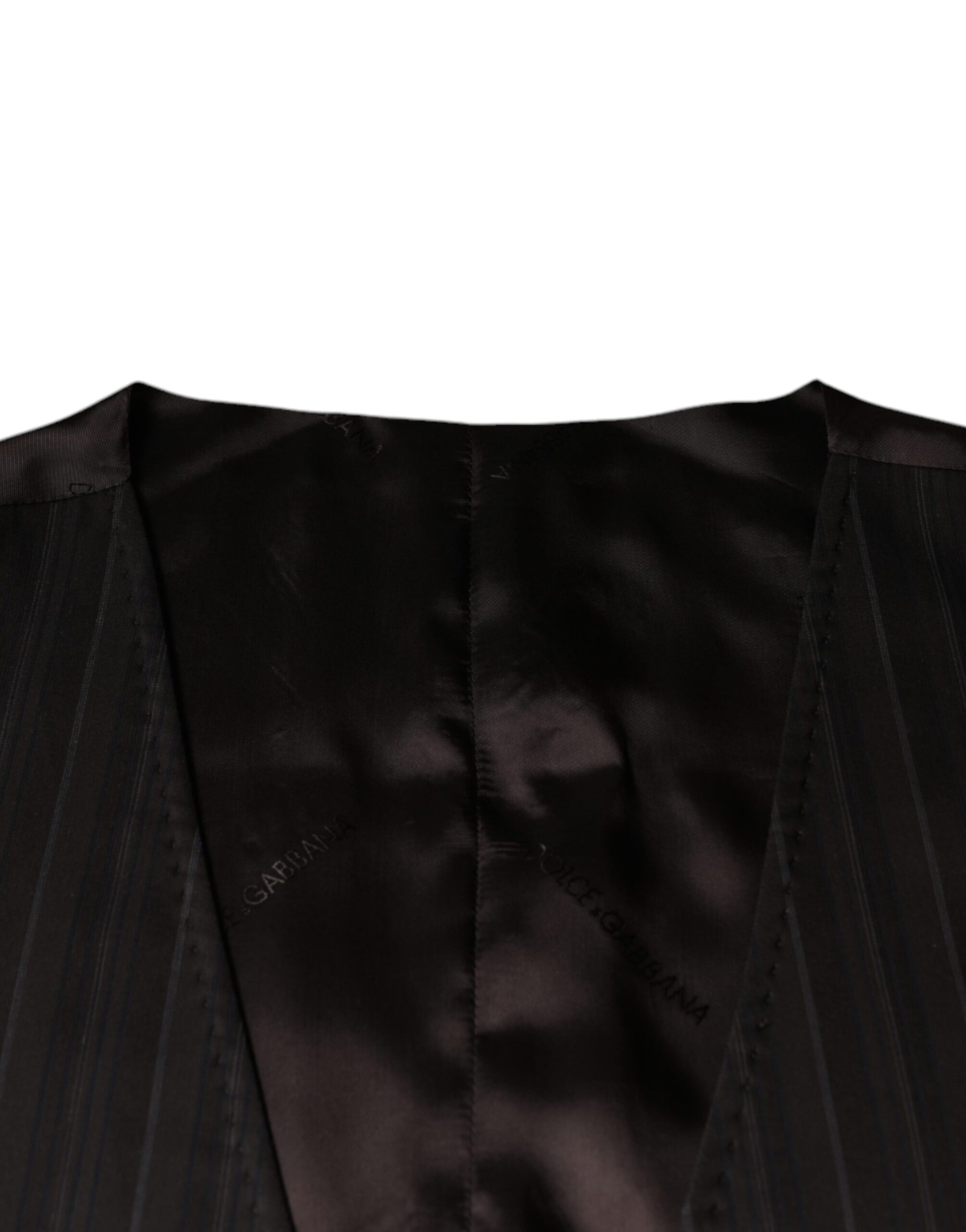 A black cotton waistcoat with a textured pattern, featuring a lapel collar and two front pockets