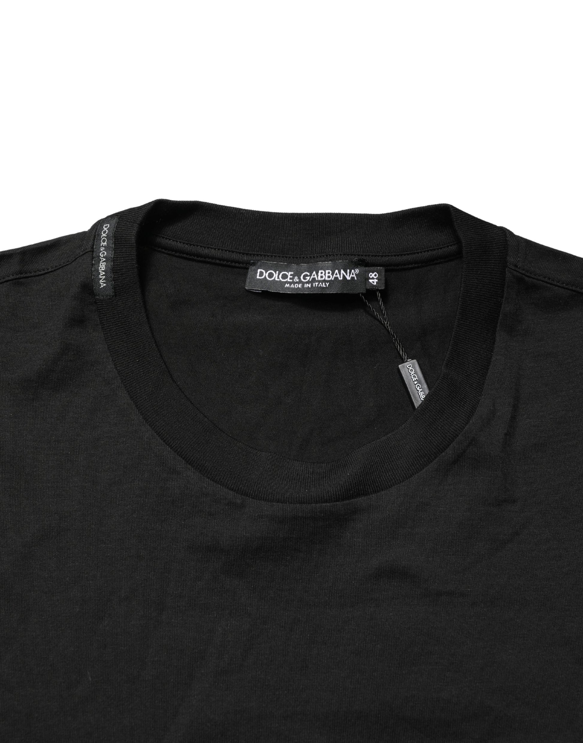 Black long sleeve sweater on hanger