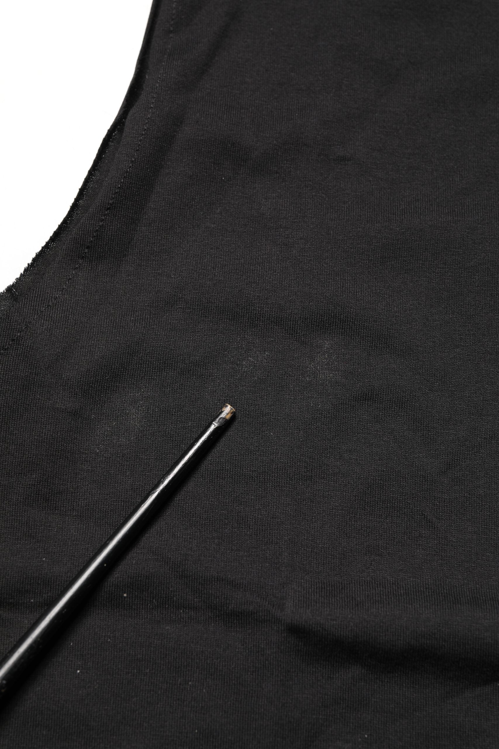 Black fabric with a black wire on top