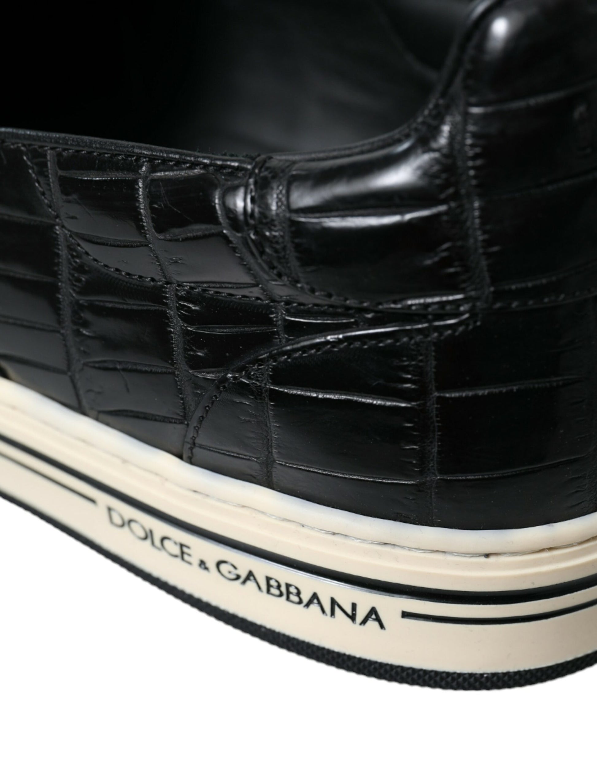 Black and white sneaker with crocodile skin texture on upper