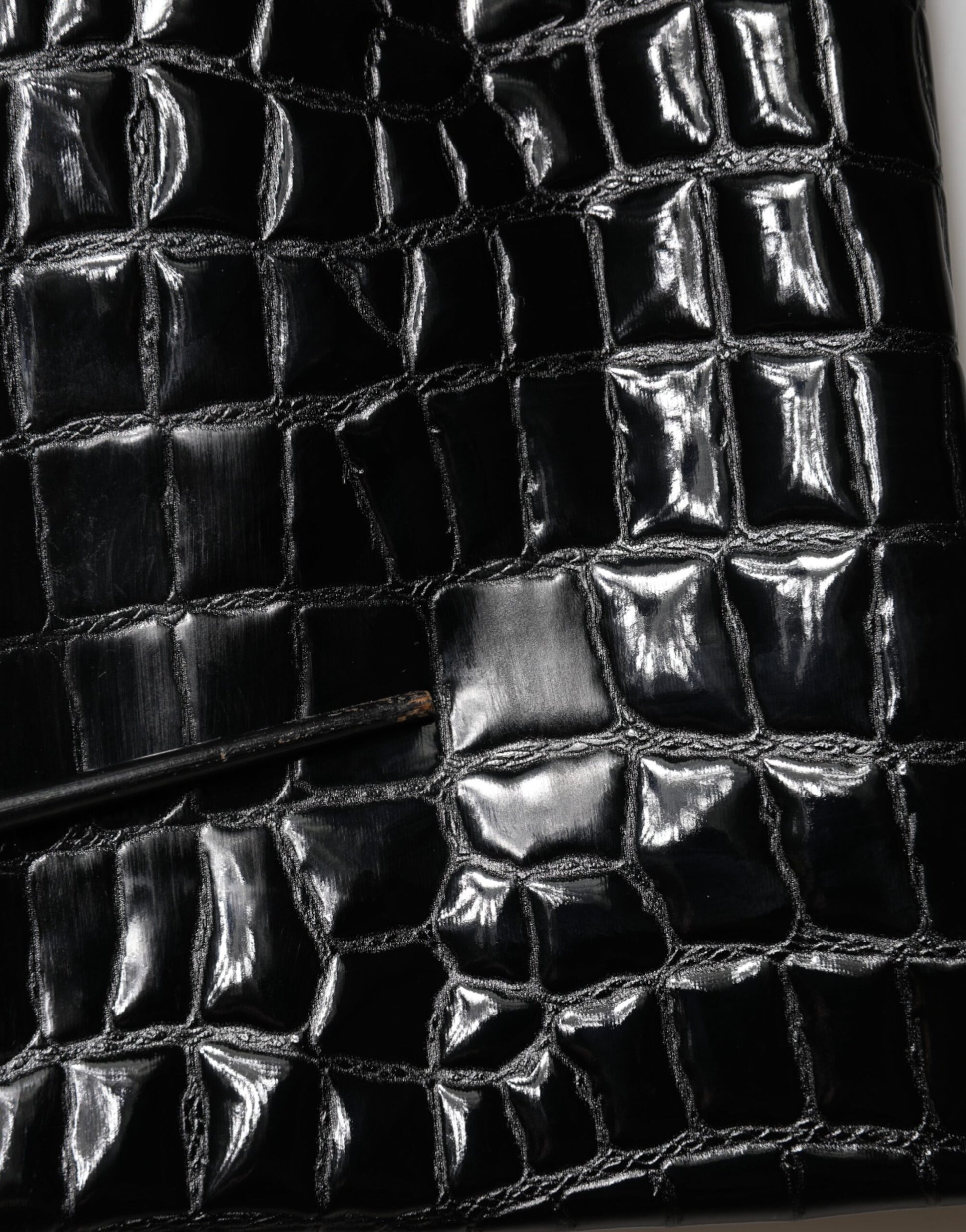 Black leather handbag with visible stitching