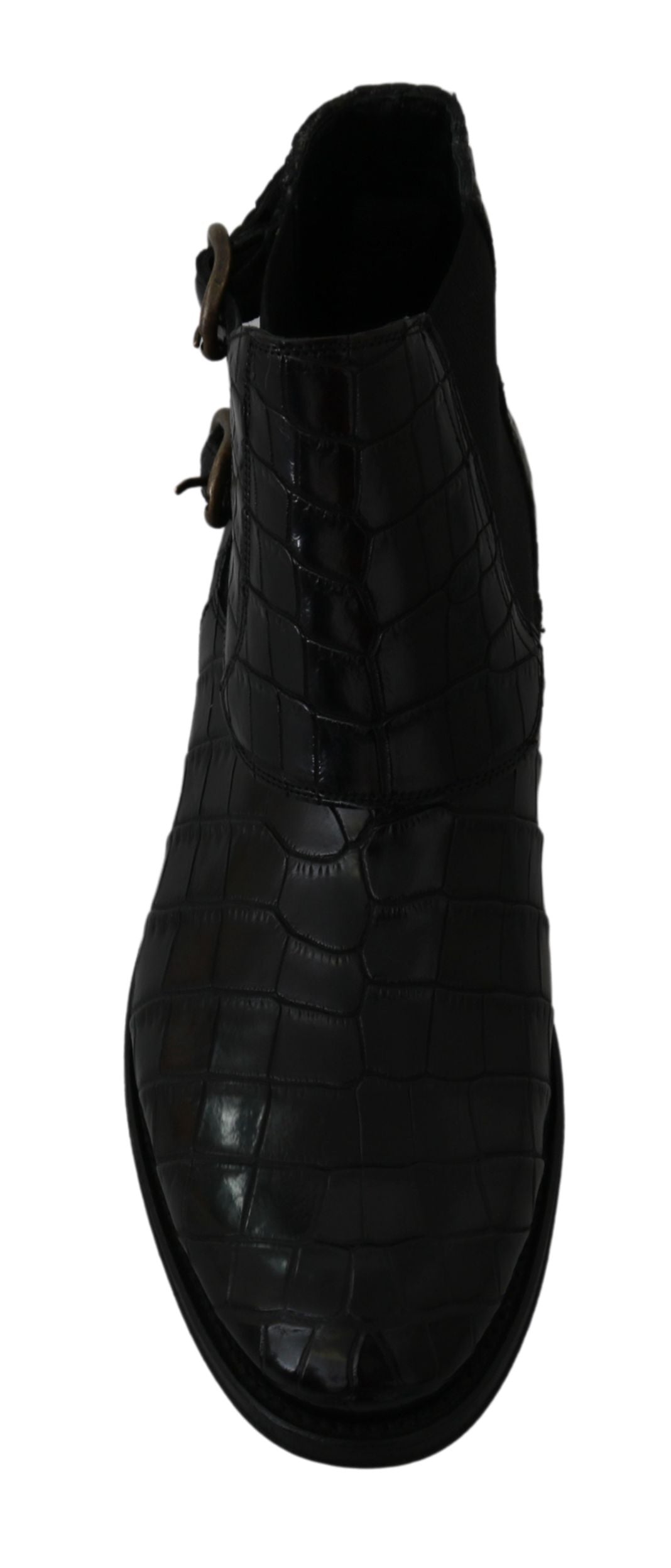 Black leather shoe with a strap and buckle closure