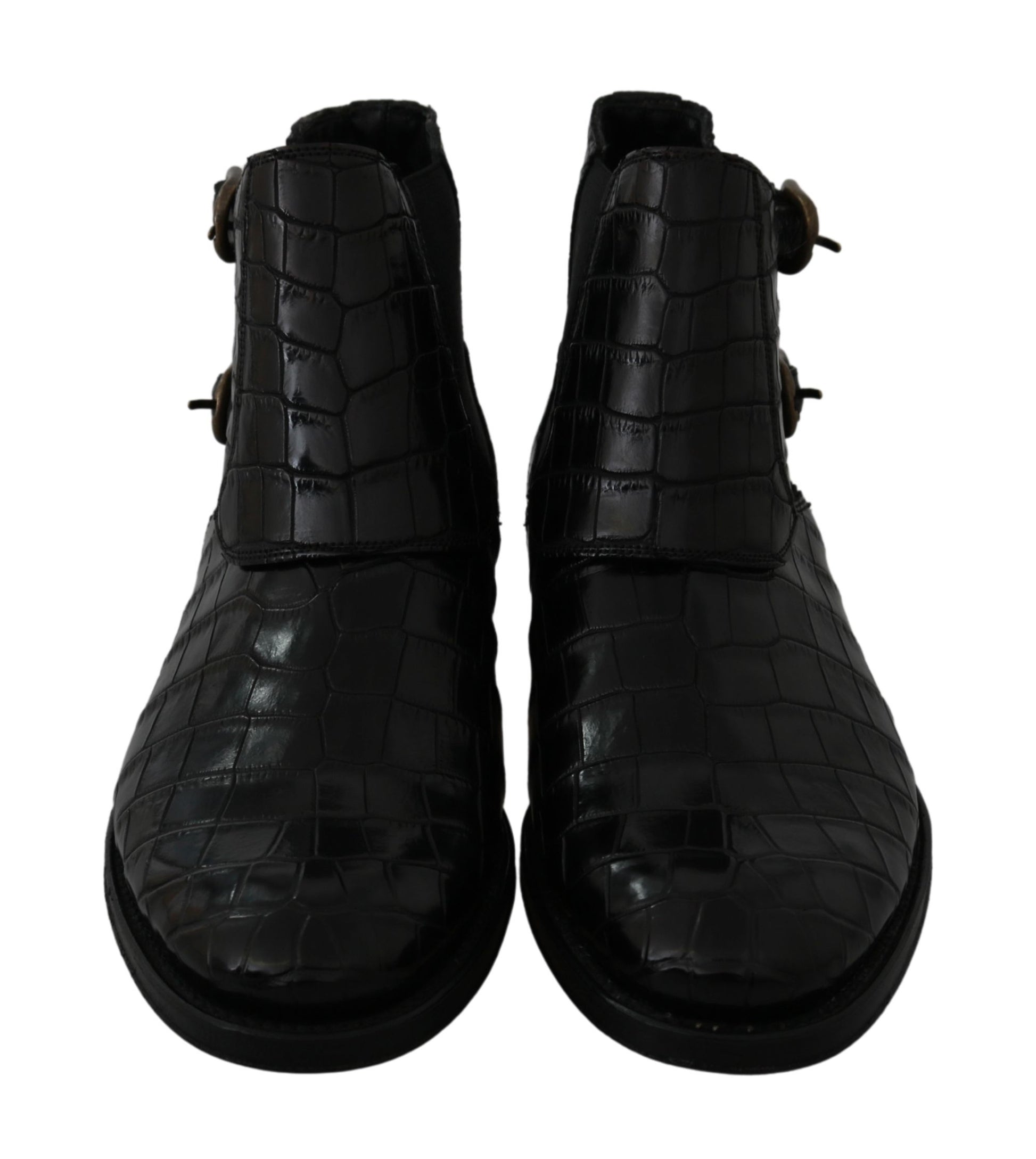 Pair of black leather boots with buckles and a round toe