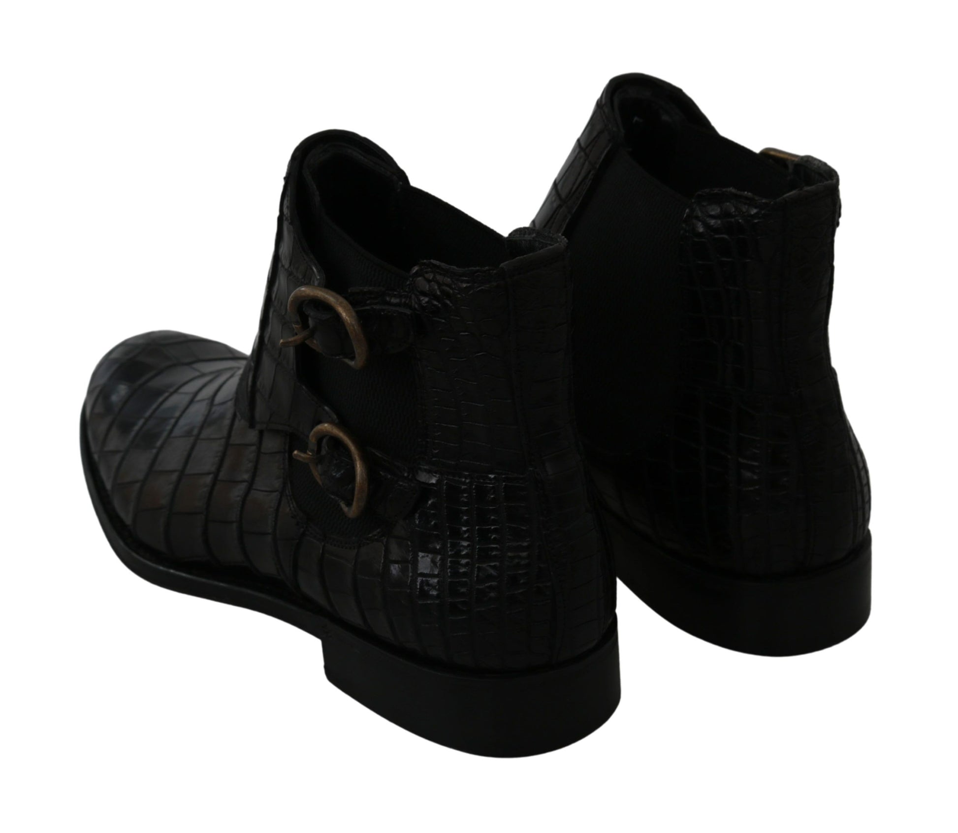 Pair of black leather boots with gold buckles and laces