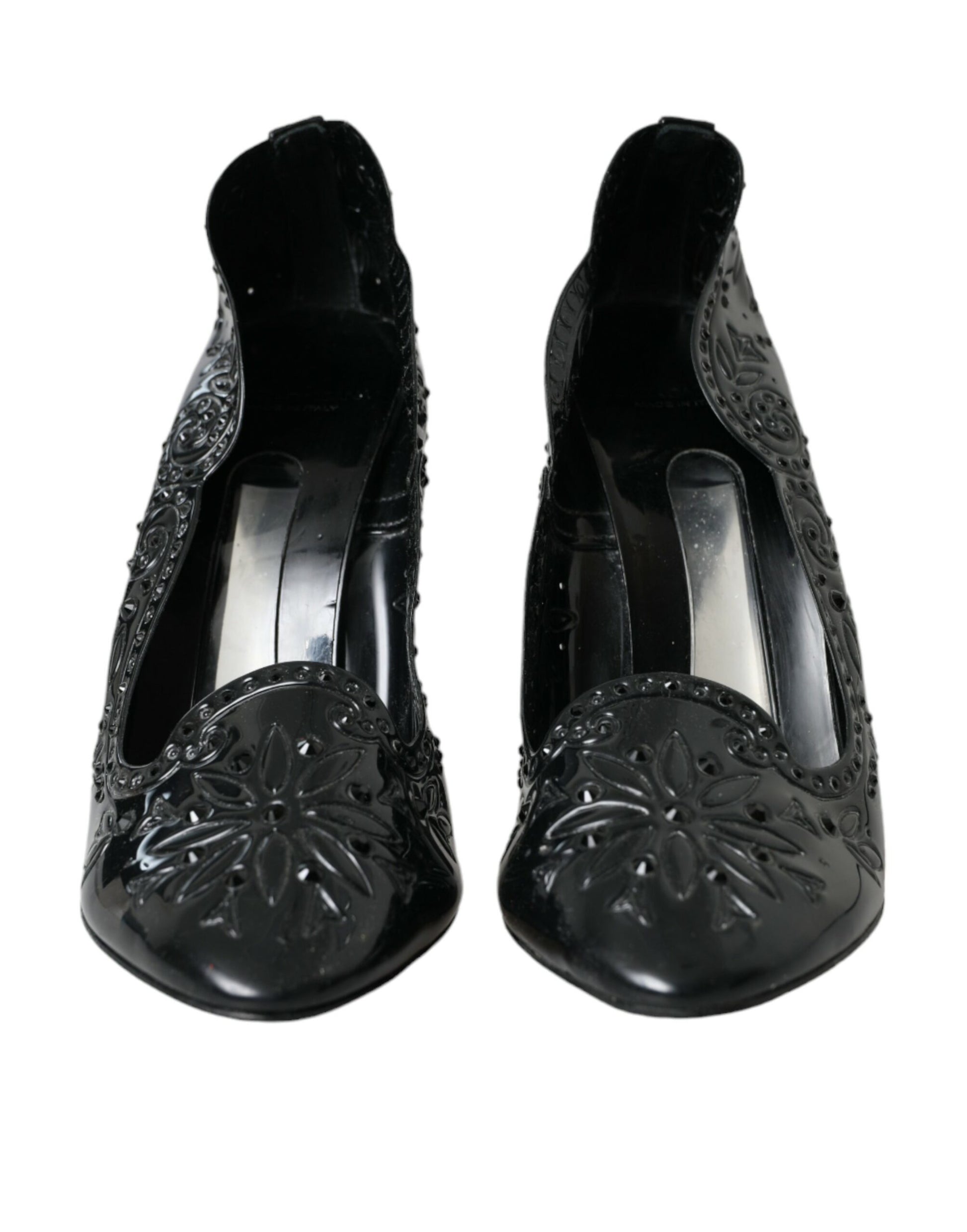 Pair of black high heel shoes with embellishments and a bow on top