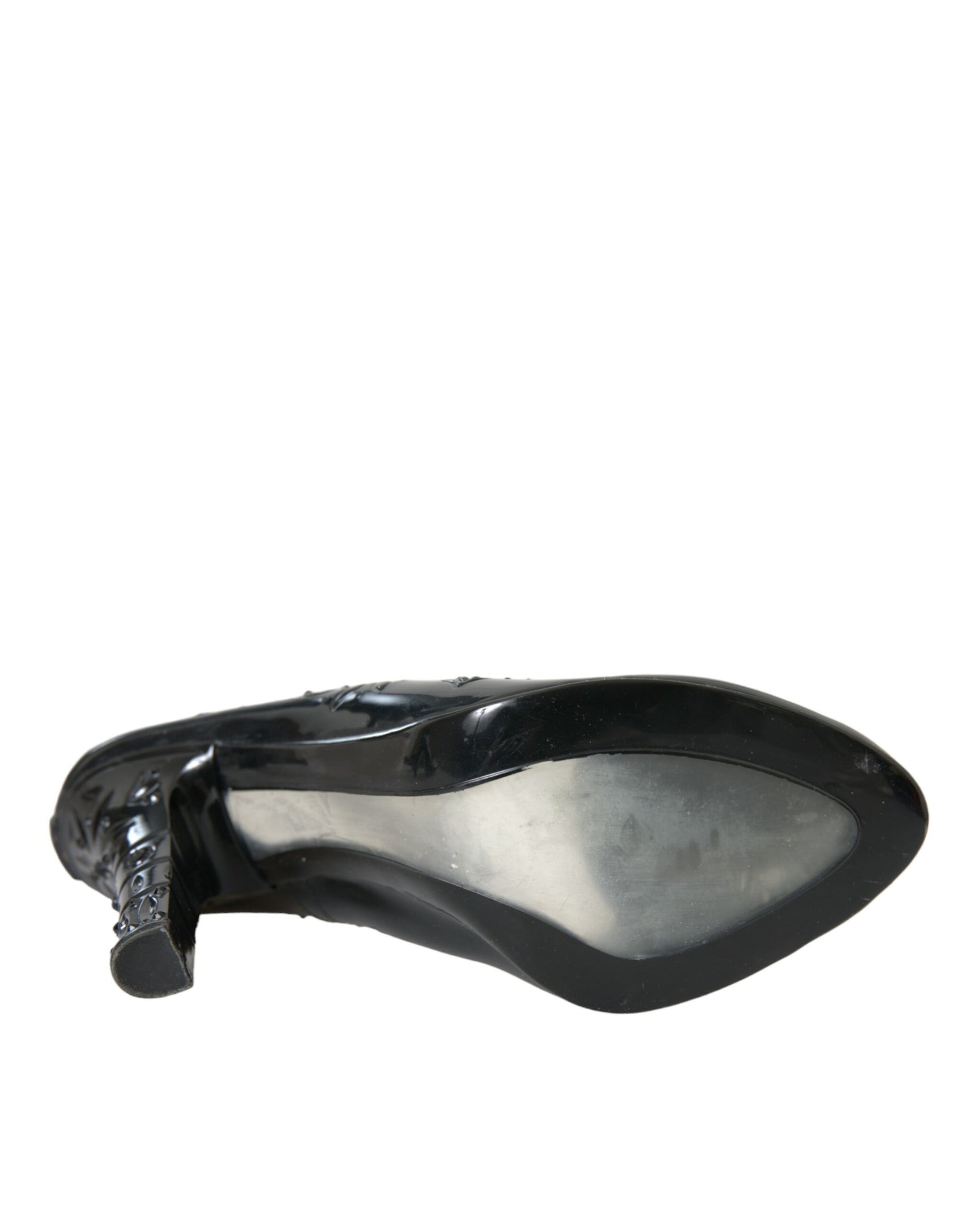 Black shoe with a pointed toe and a strap across the top