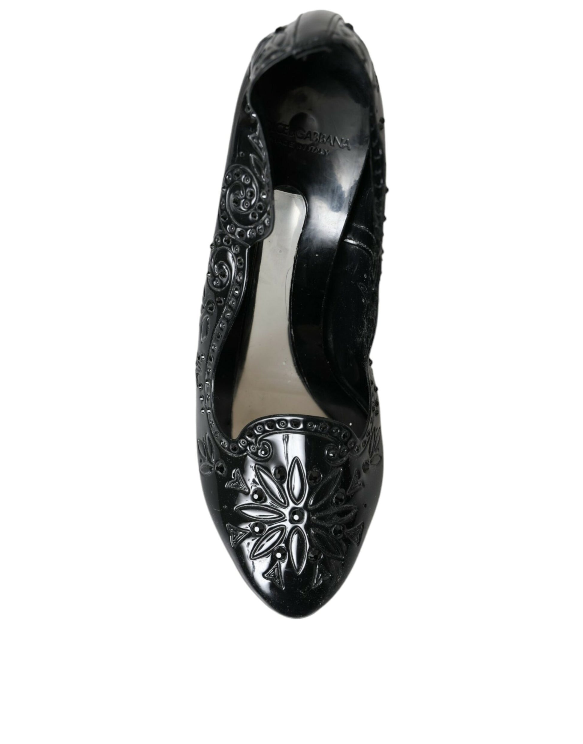 Black shoe with floral design on toe and heel