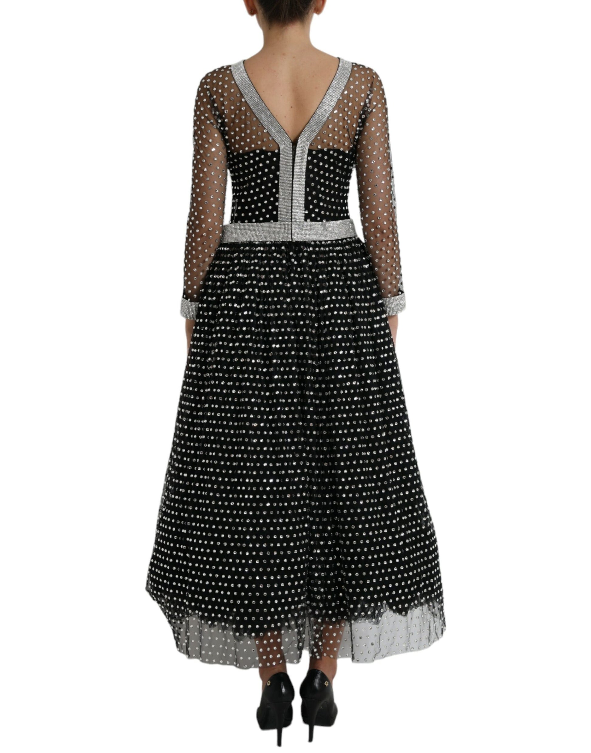 Long black dress with crystal embellishments and white trim, designed by Dolce & Gabbana