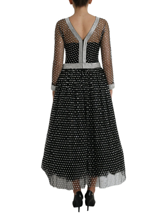Long black dress with crystal embellishments and white trim, designed by Dolce & Gabbana