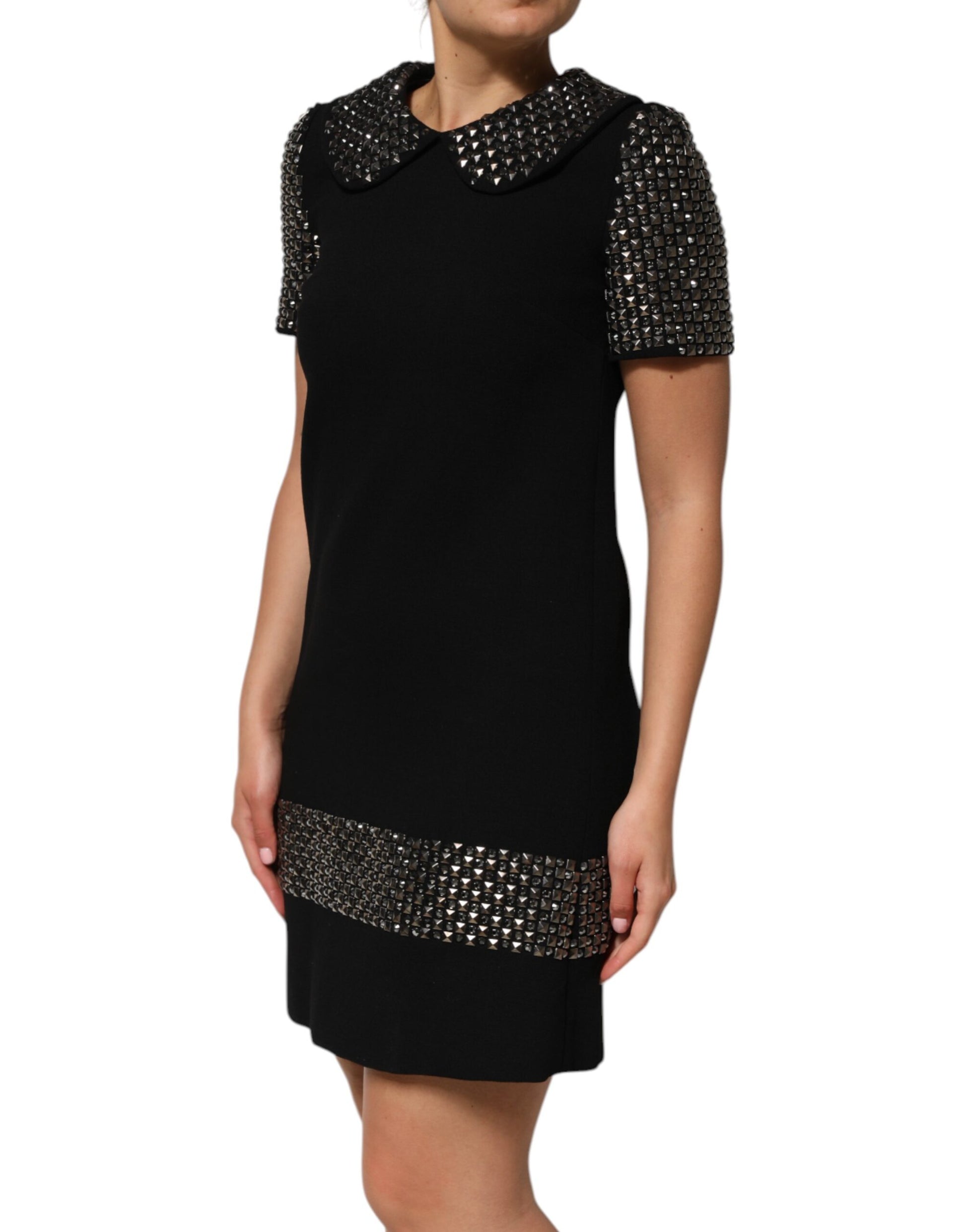 A black dress with crystal embellishments and a collar, from the brand Dolce & Gabbana