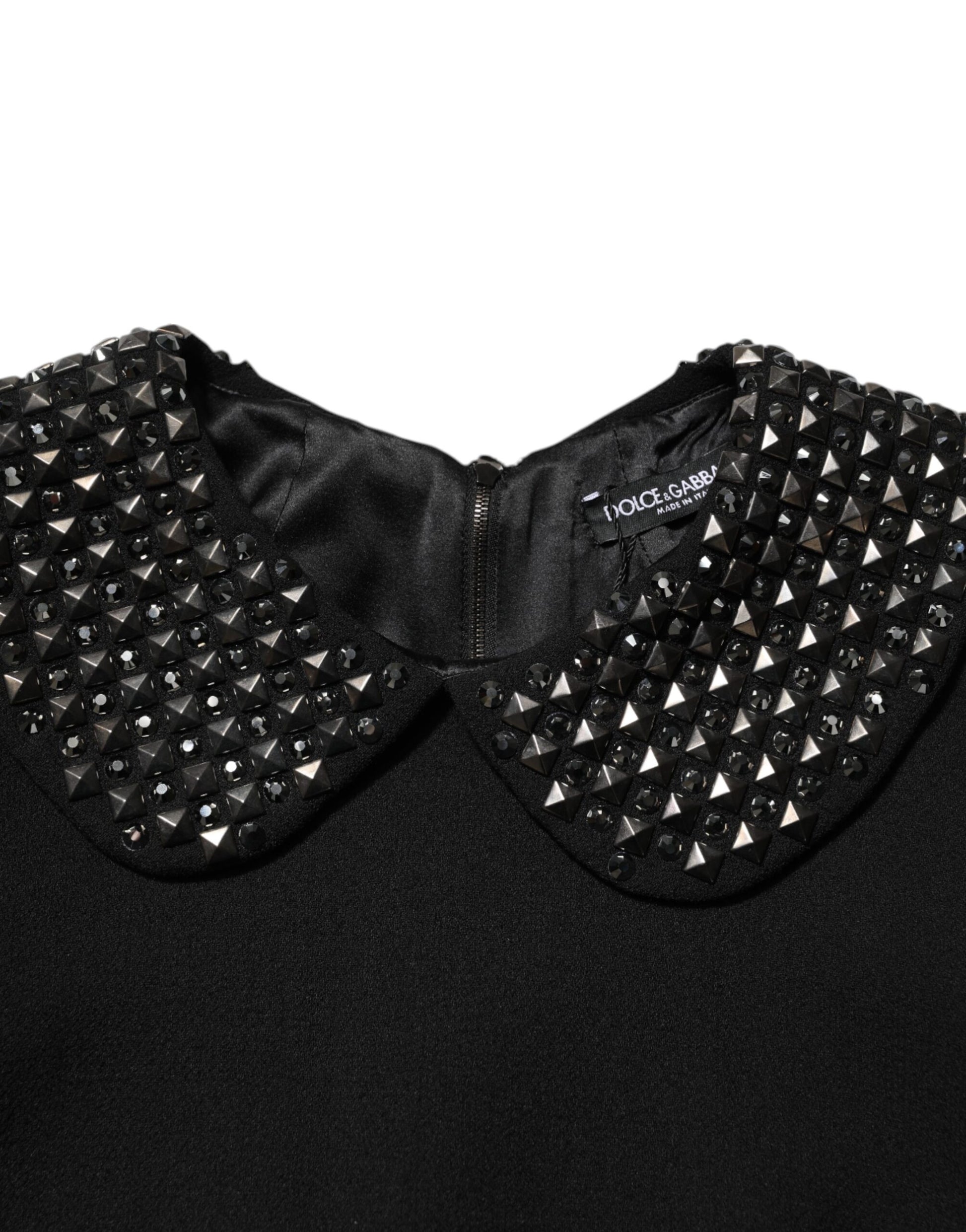 A black dress with crystal embellishments on the collar and neckline