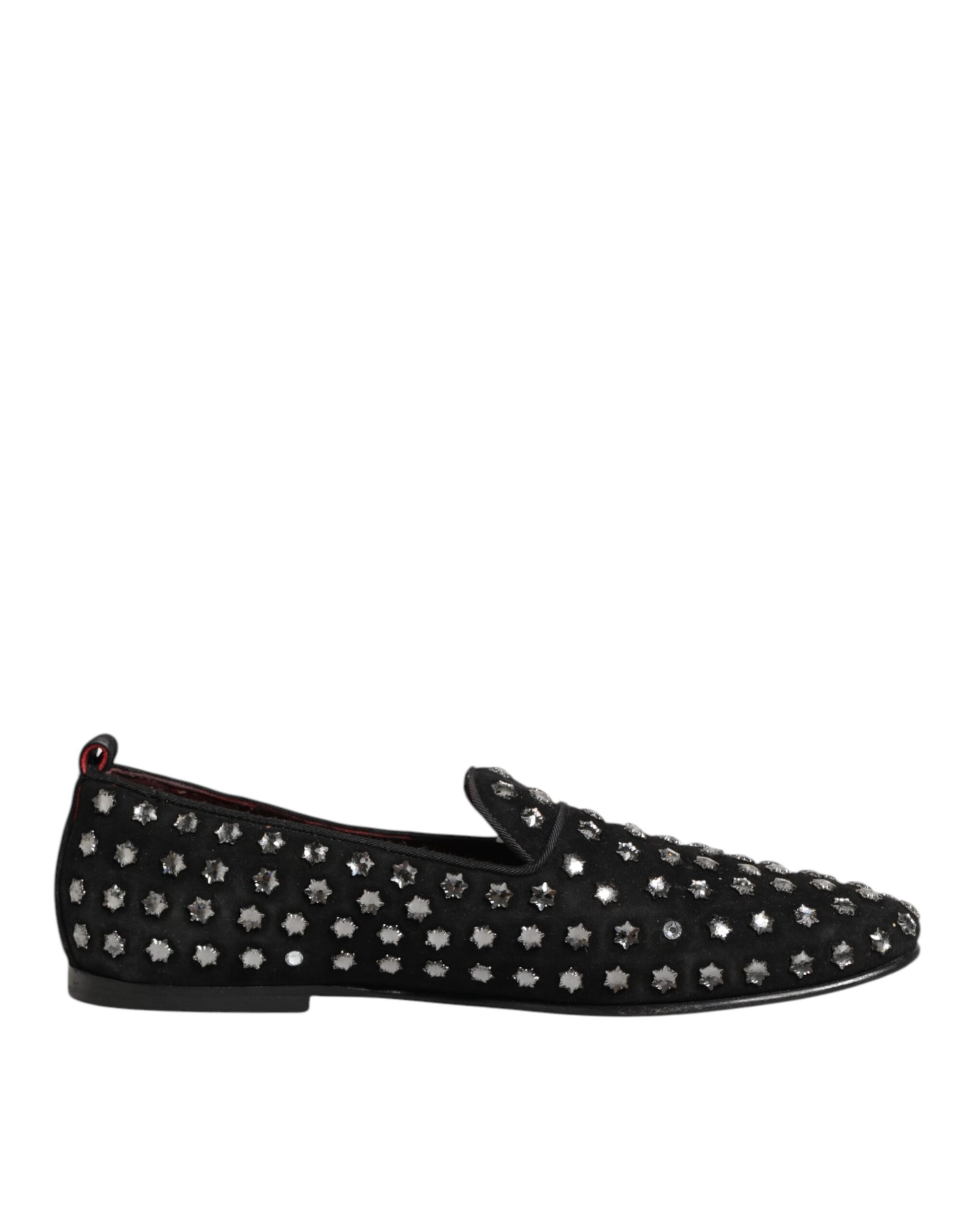 A pair of black loafers with crystal embellishments, featuring a pointed toe and elastic panels for comfort