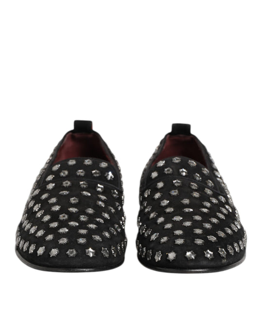 Pair of black loafers with crystal embellishments, featuring a round toe and elastic panels for comfort