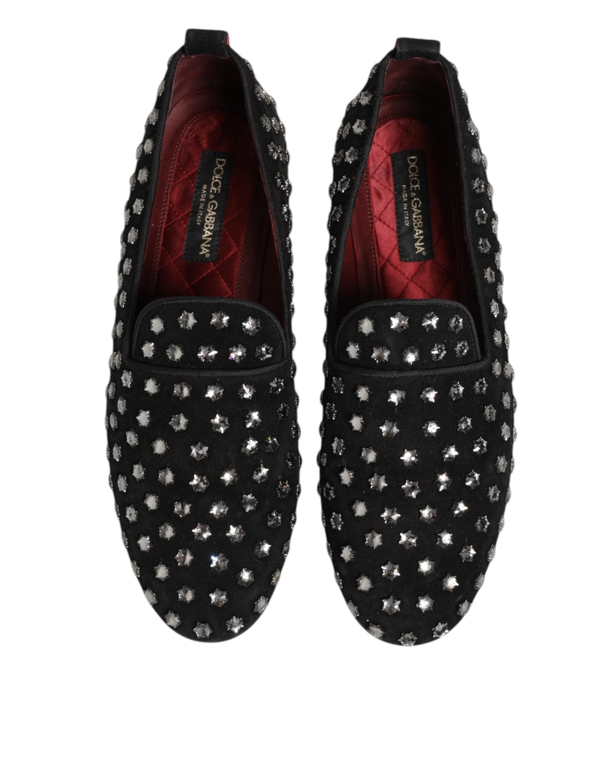 Pair of black loafers with crystal embellishments, featuring a red interior and a bow on the side