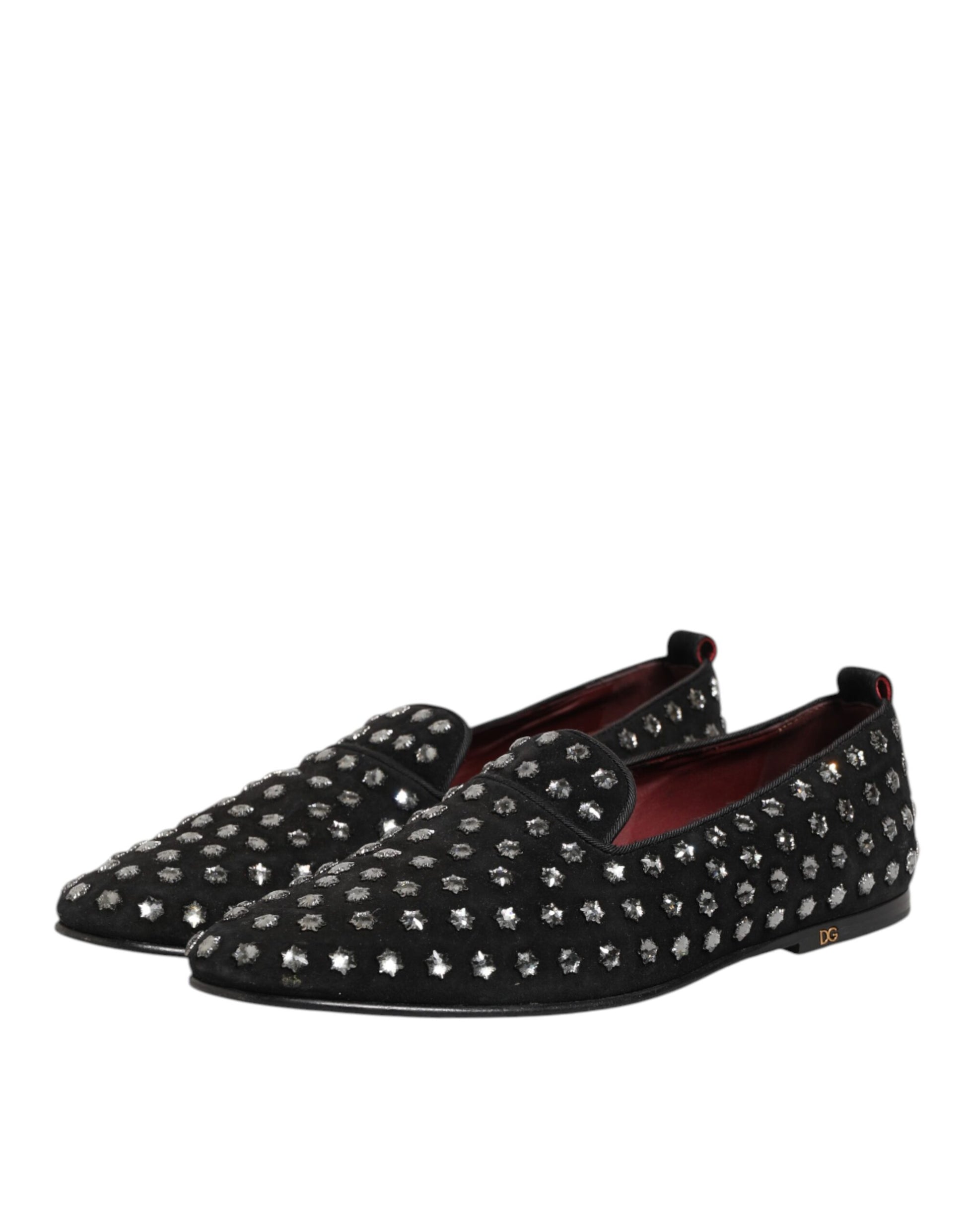 A pair of black loafers with crystal embellishments, featuring a round toe and elastic panels for comfort