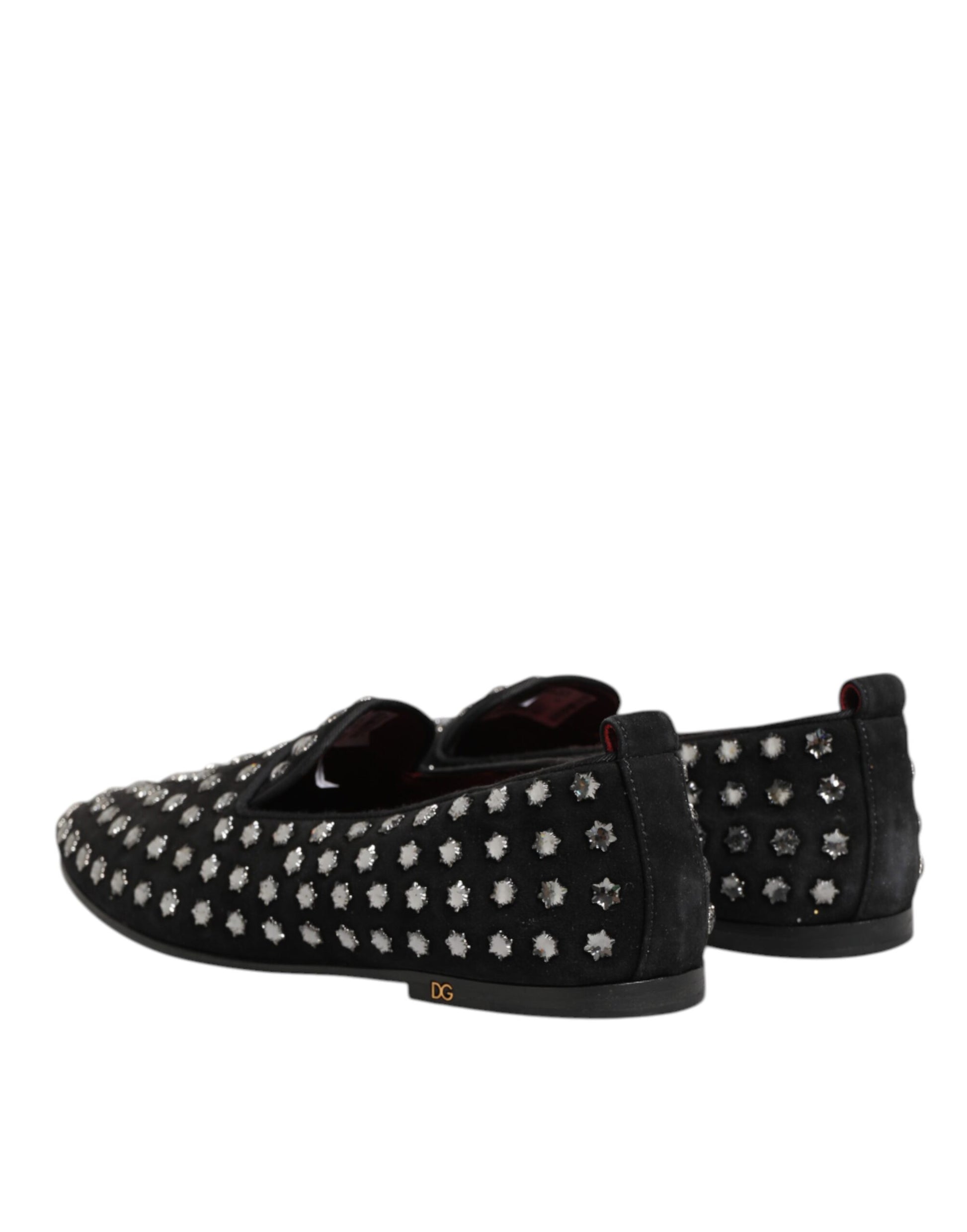 A pair of black loafers with crystal embellishments, featuring a glossy finish and the Dolce & Gabbana logo