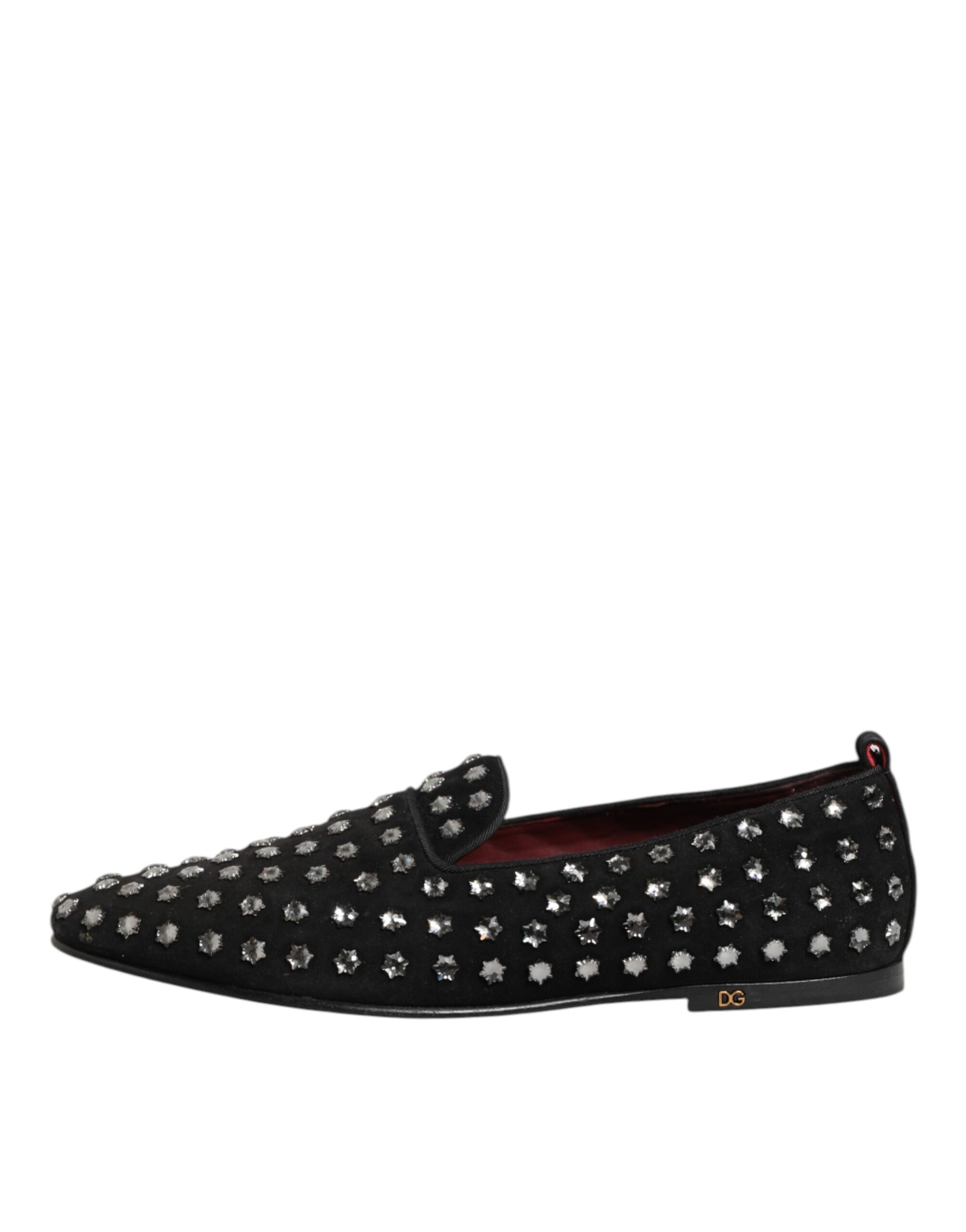 A pair of black loafers with crystal embellishments, featuring a red logo on the side