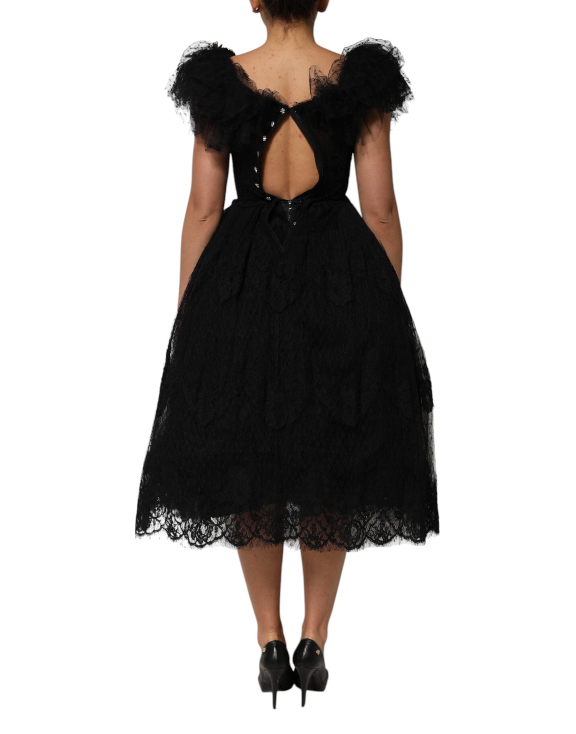Black midi dress with crystal embellishments and backless design