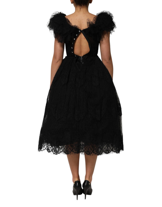 Black midi dress with crystal embellishments and backless design
