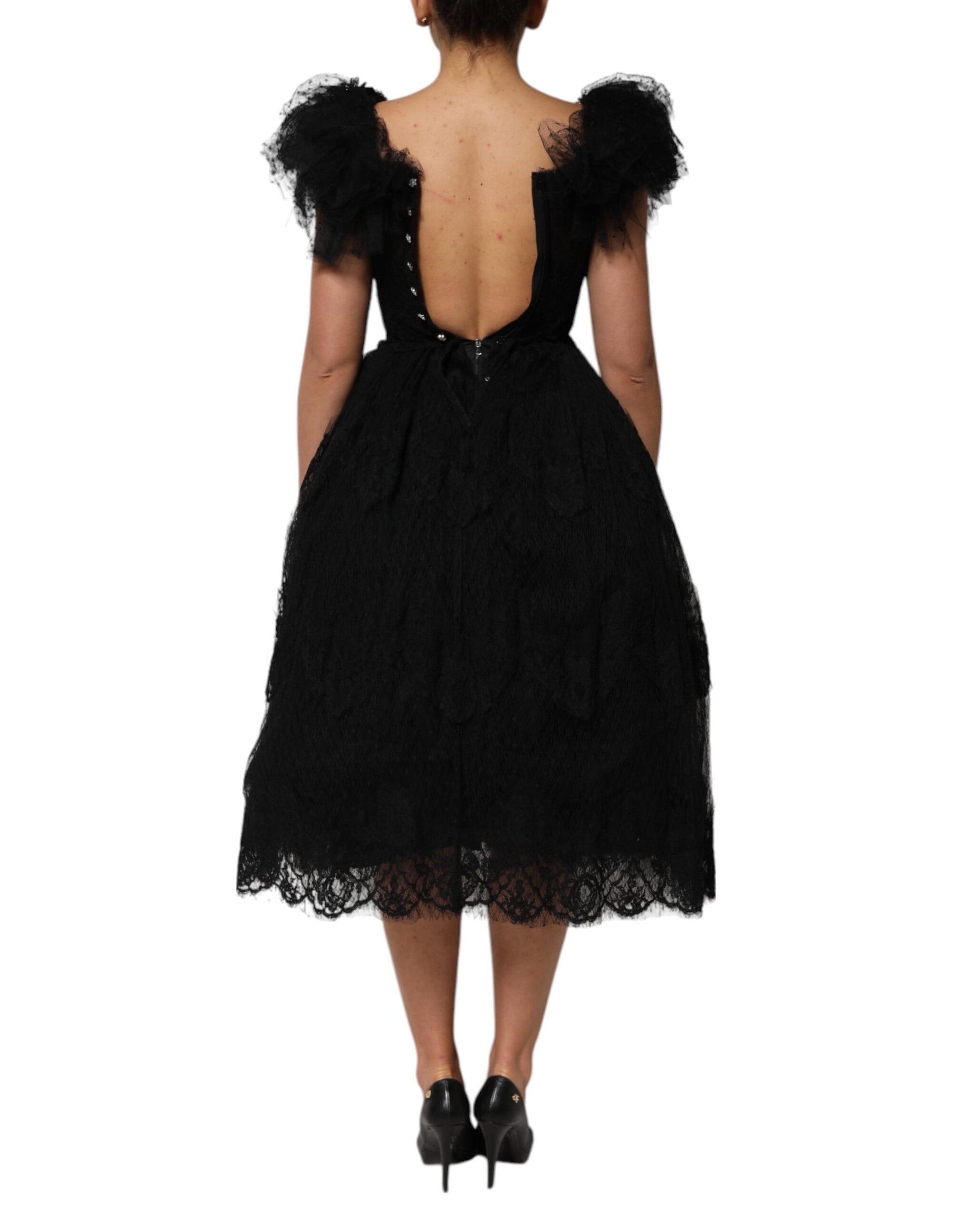 A black midi dress with crystal embellishments on the bodice
