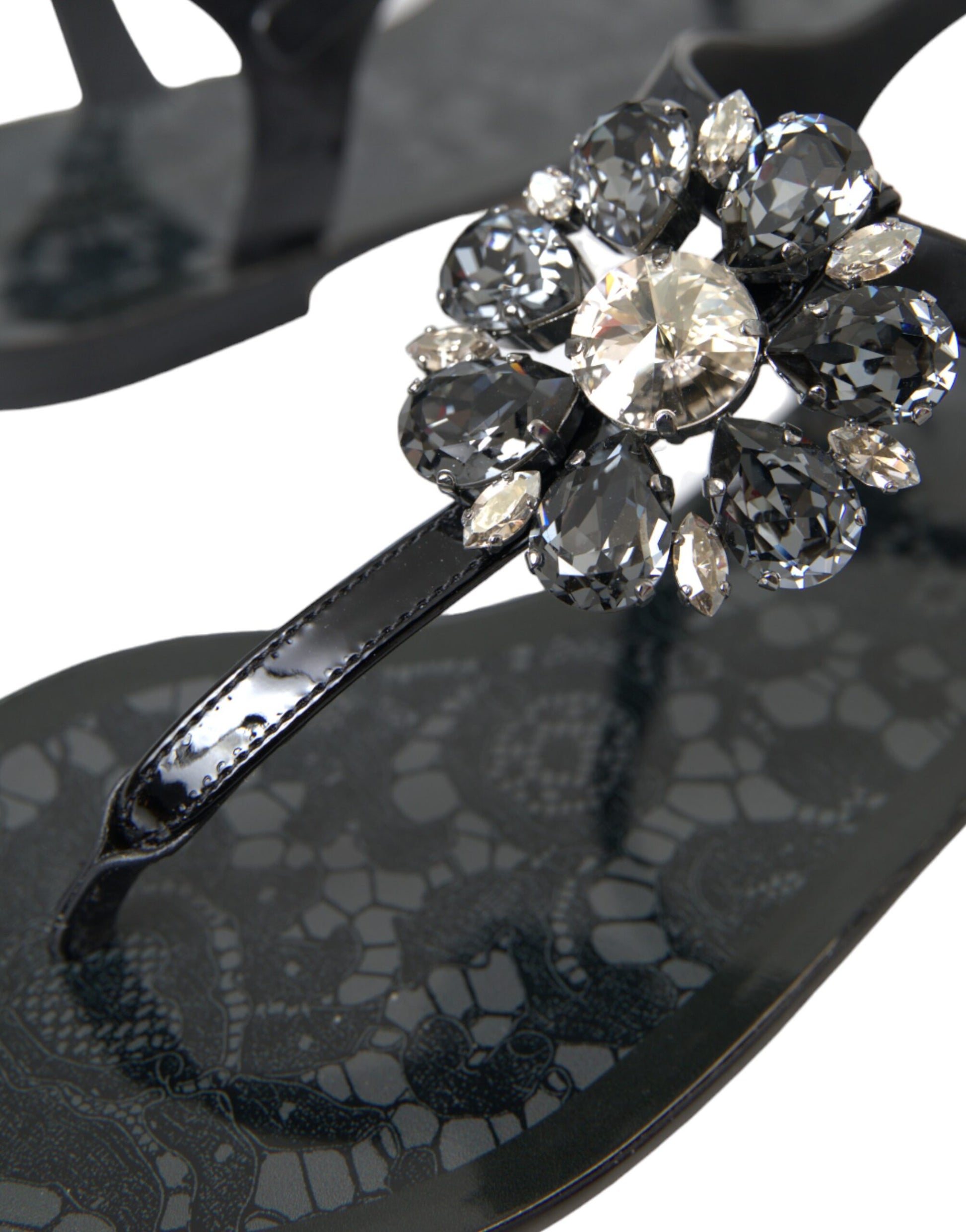 Silver jewelry on black sandal
