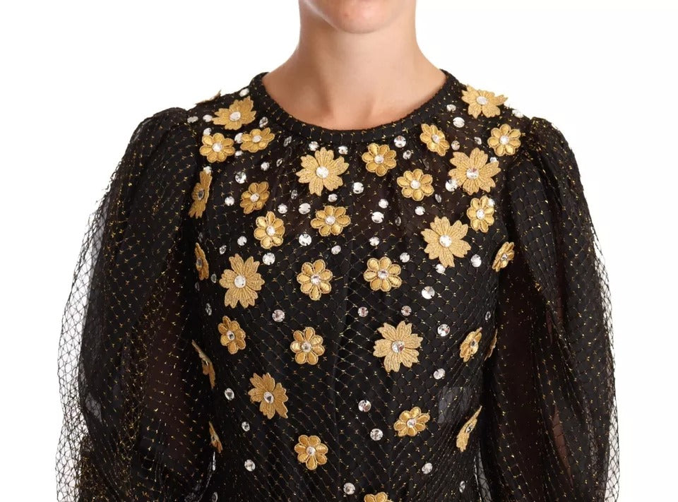 A black dress with floral embroidery and crystals on the bodice