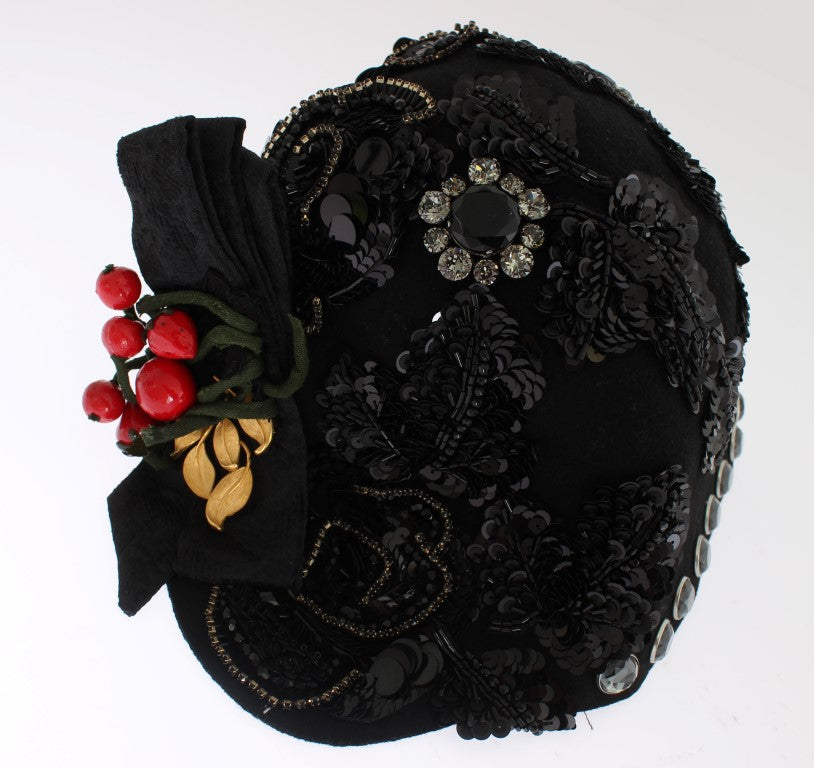 Decorative black hat with embellishments including berries, leaves, and a bow