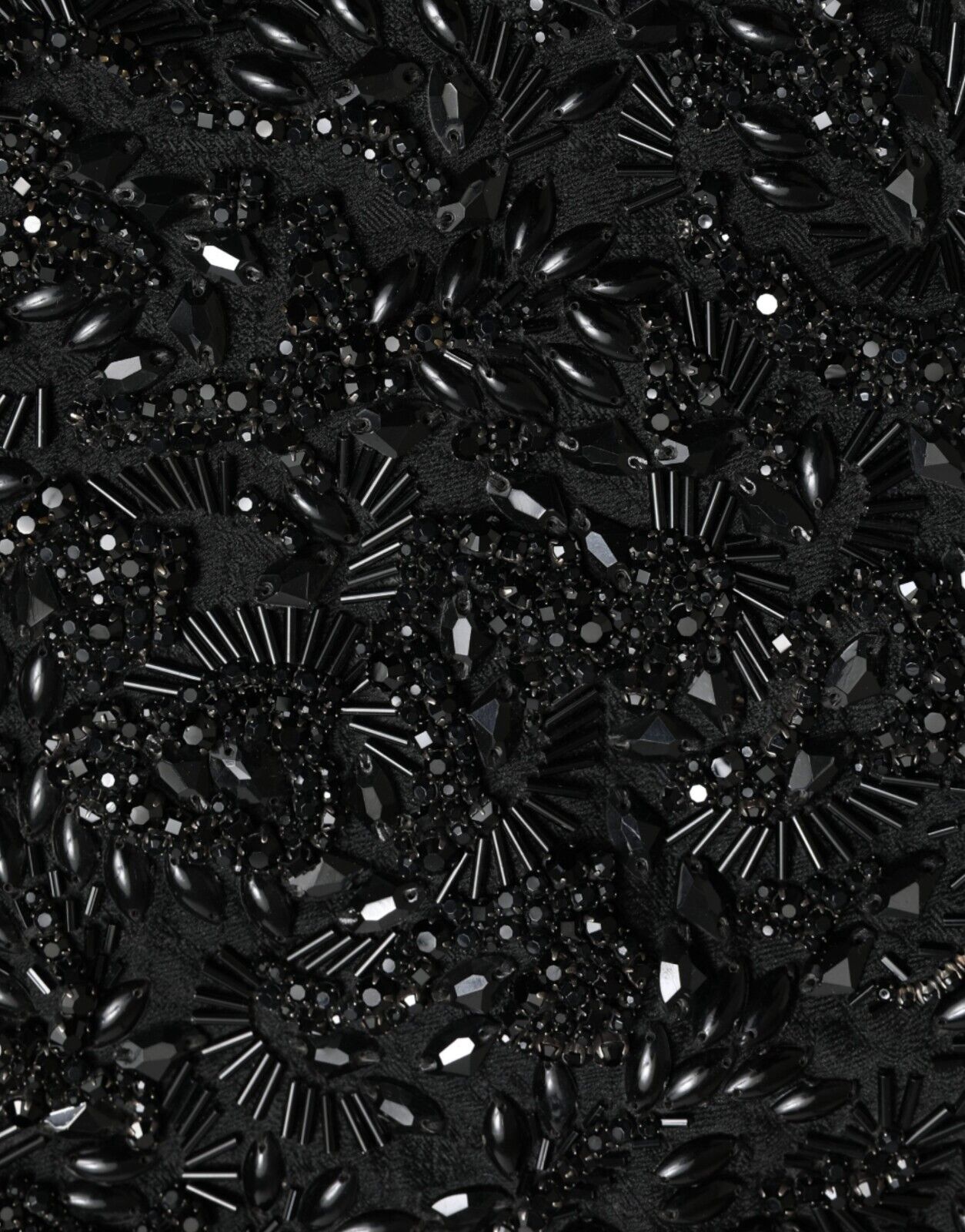 Black sequined garment with multiple layers of shiny stones