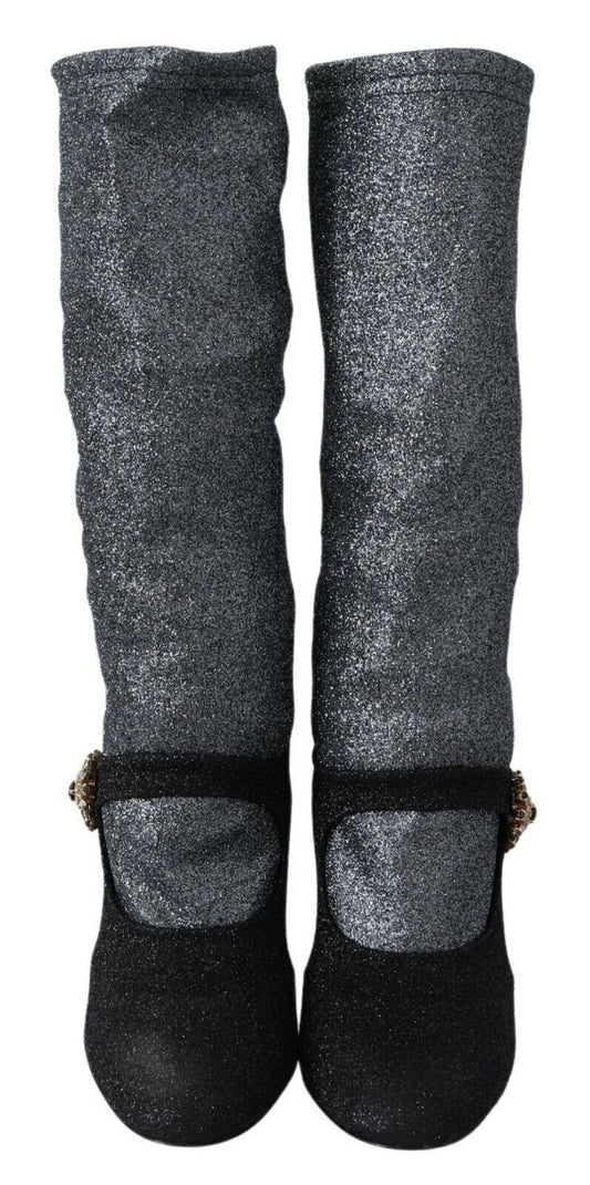 Two black glittery knee high boots with a shiny texture and a small heel