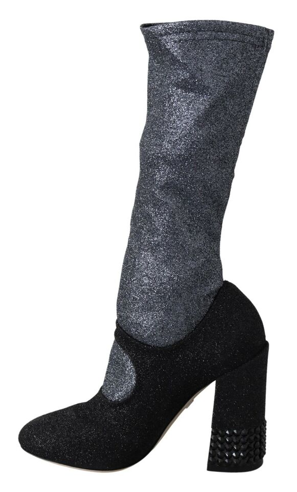 Glittery silver boots with black heels and studs