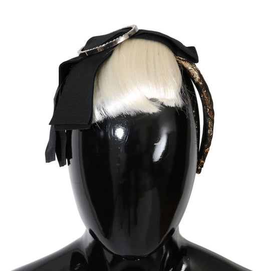 Headpiece with feathers and black ribbon on a mannequin head