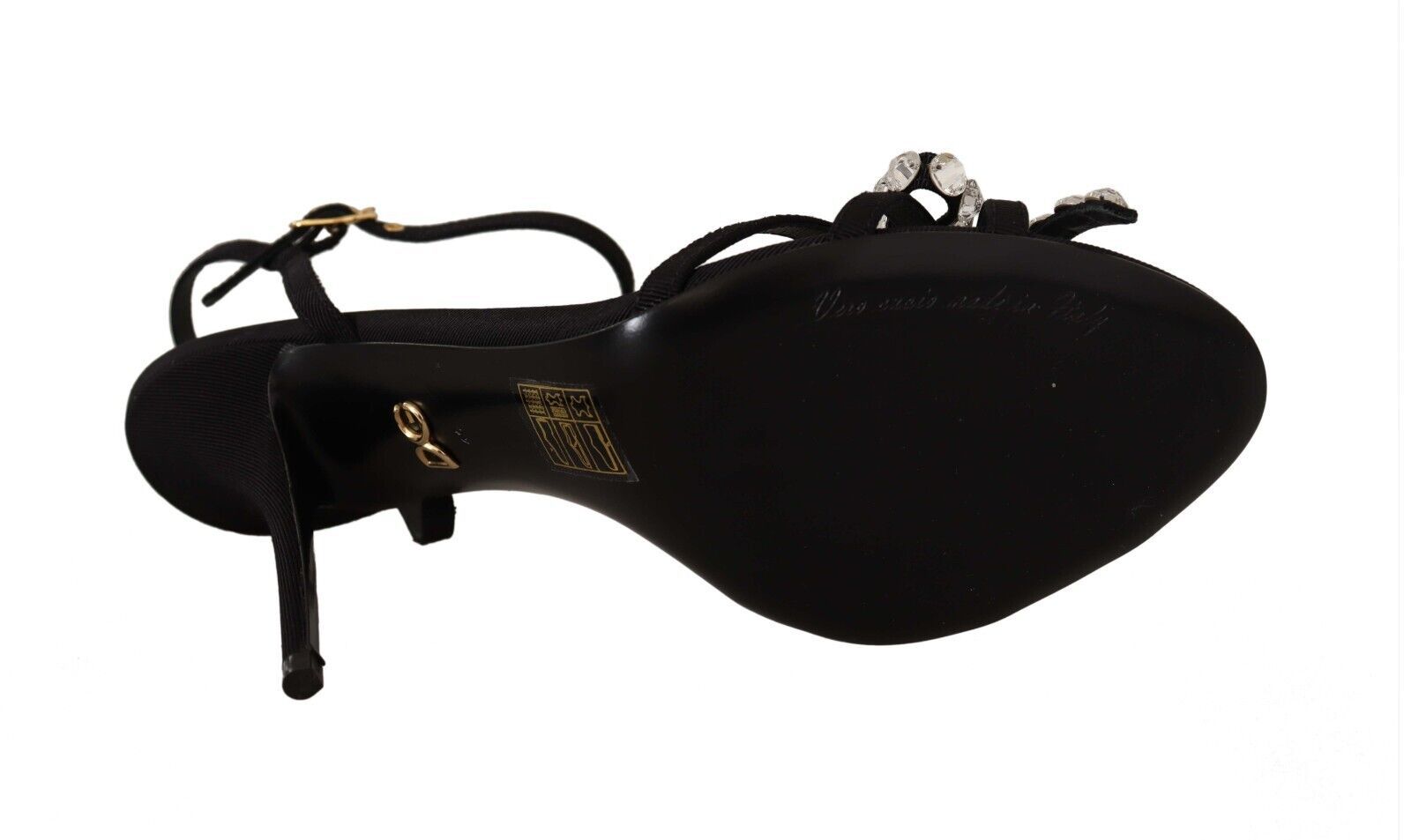 Black sandal with strap over foot