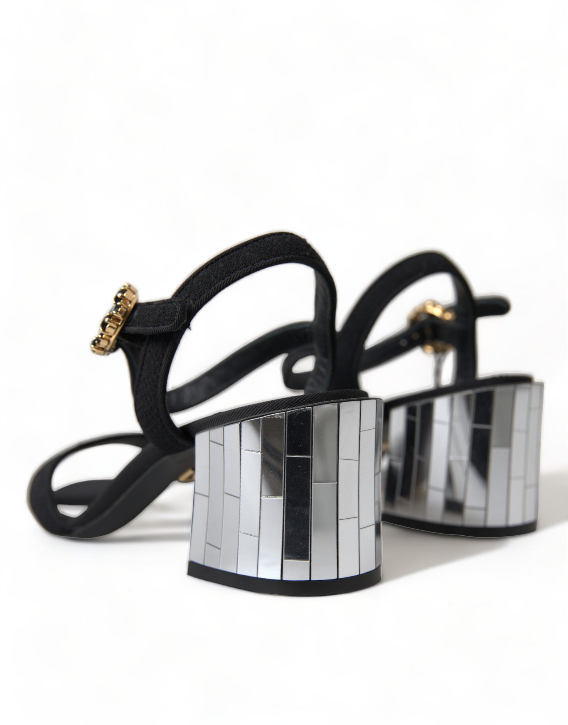 High heel shoes with black straps and silver buckles