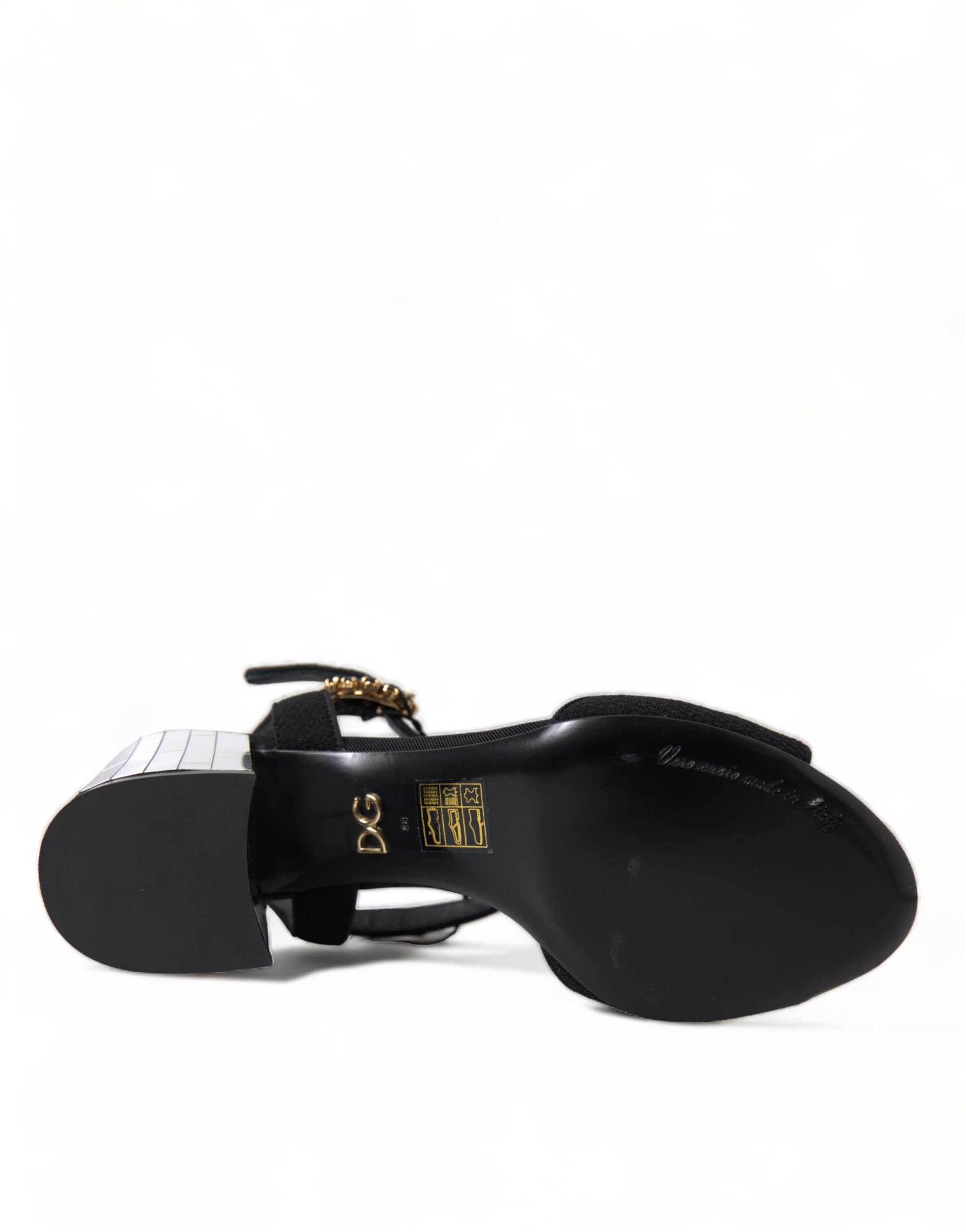 Black and white shoe with gold accents