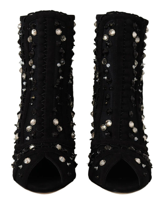 Pair of black high heel shoes with studded detailing and a pointed toe design