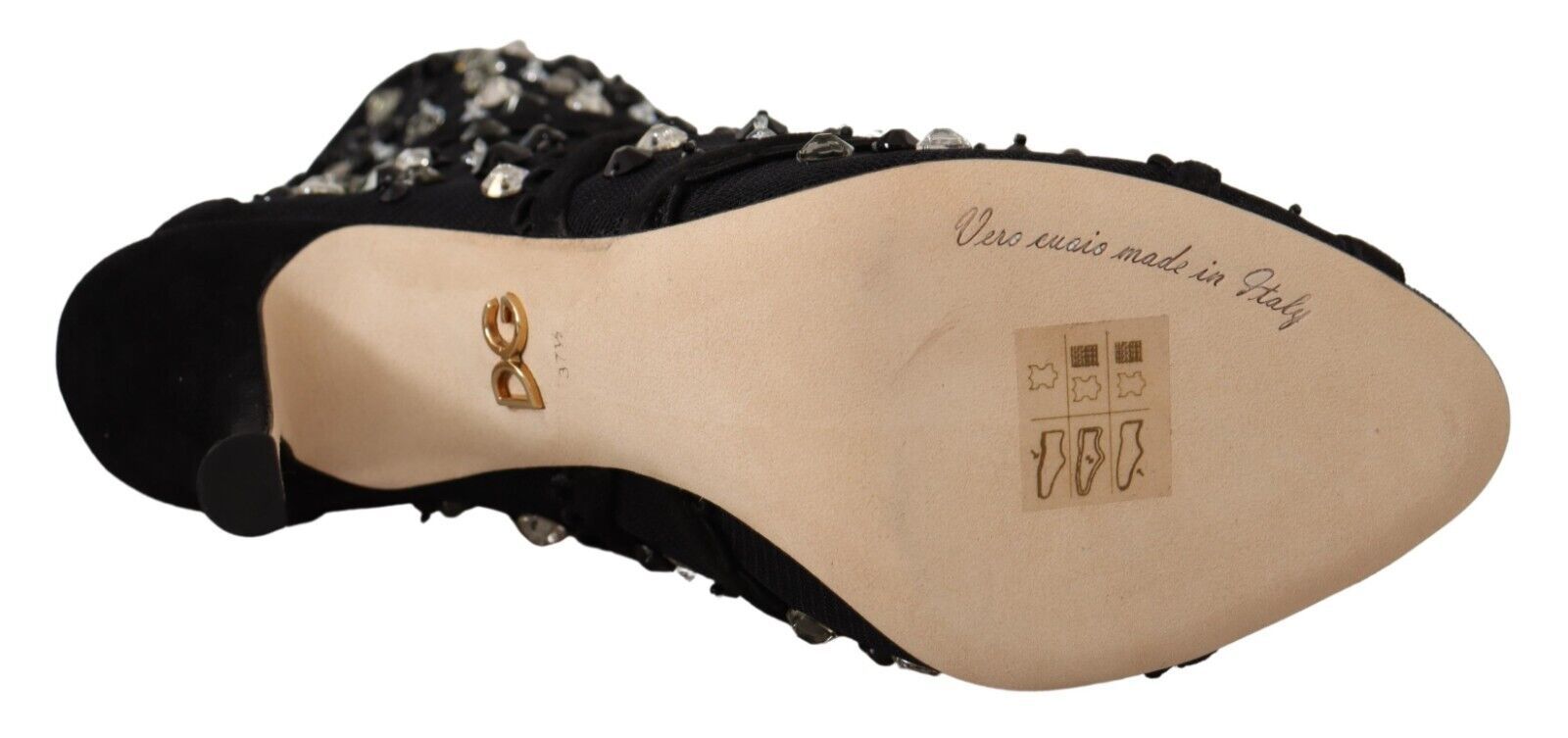 Pair of women's shoes with embroidered writing on inner side