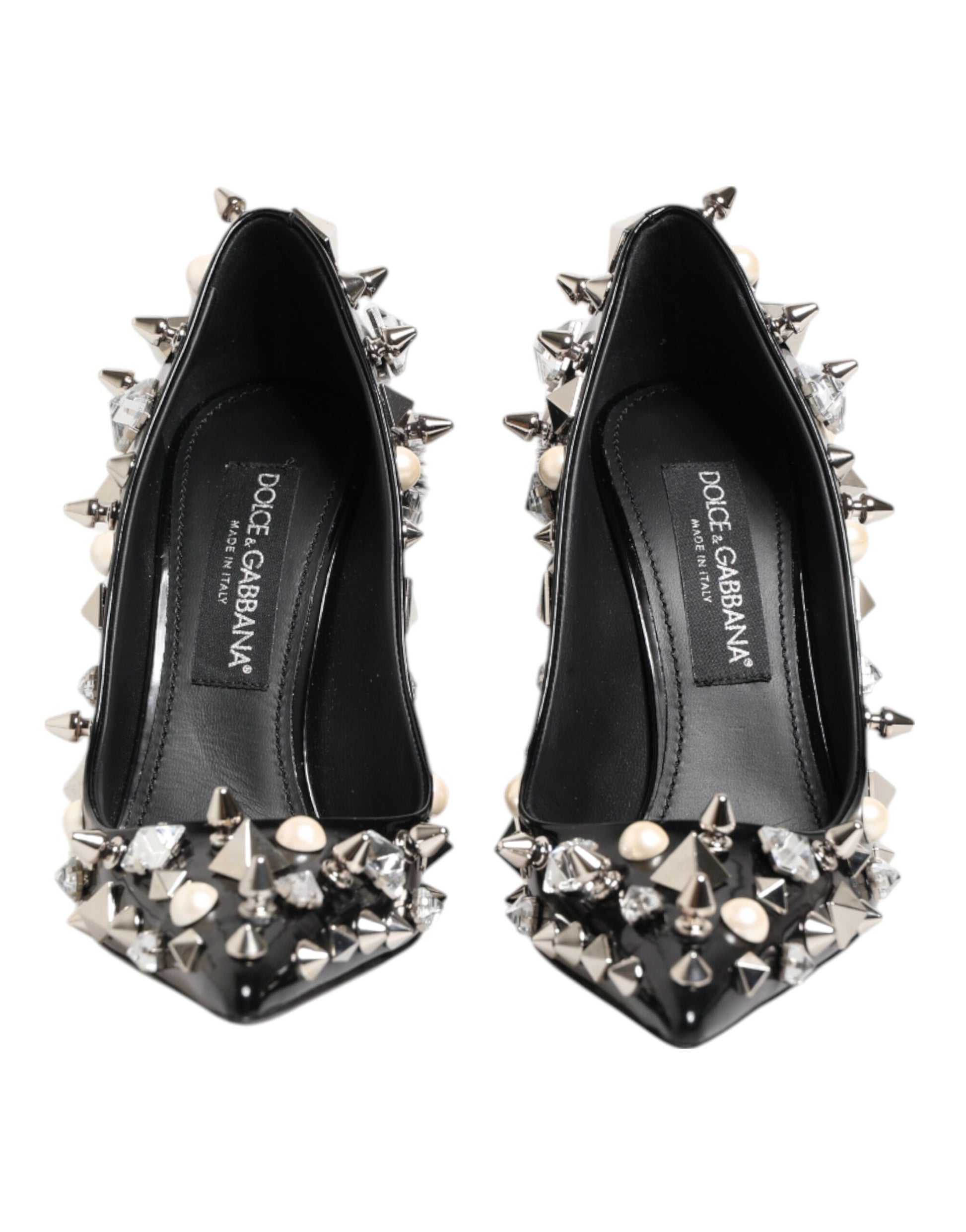 Pair of black high heel shoes with spiky studs on top