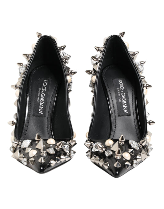 Pair of black high heel shoes with spiky studs on top