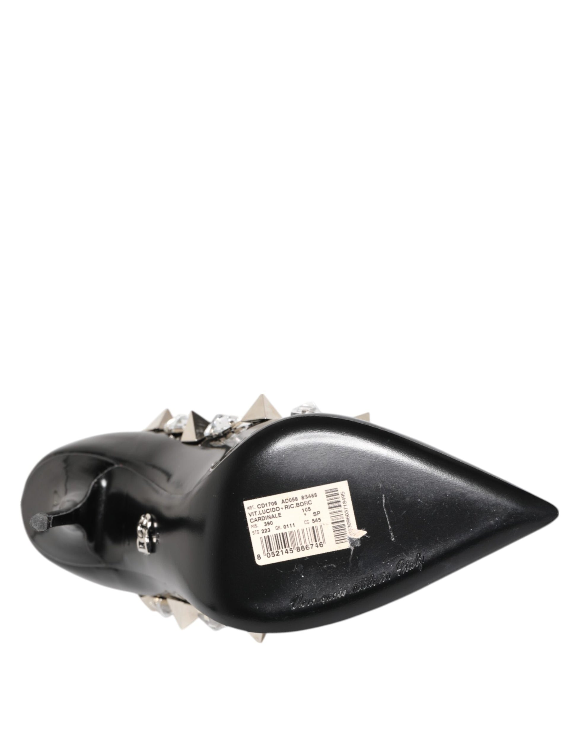 Black metal object with spikes on top