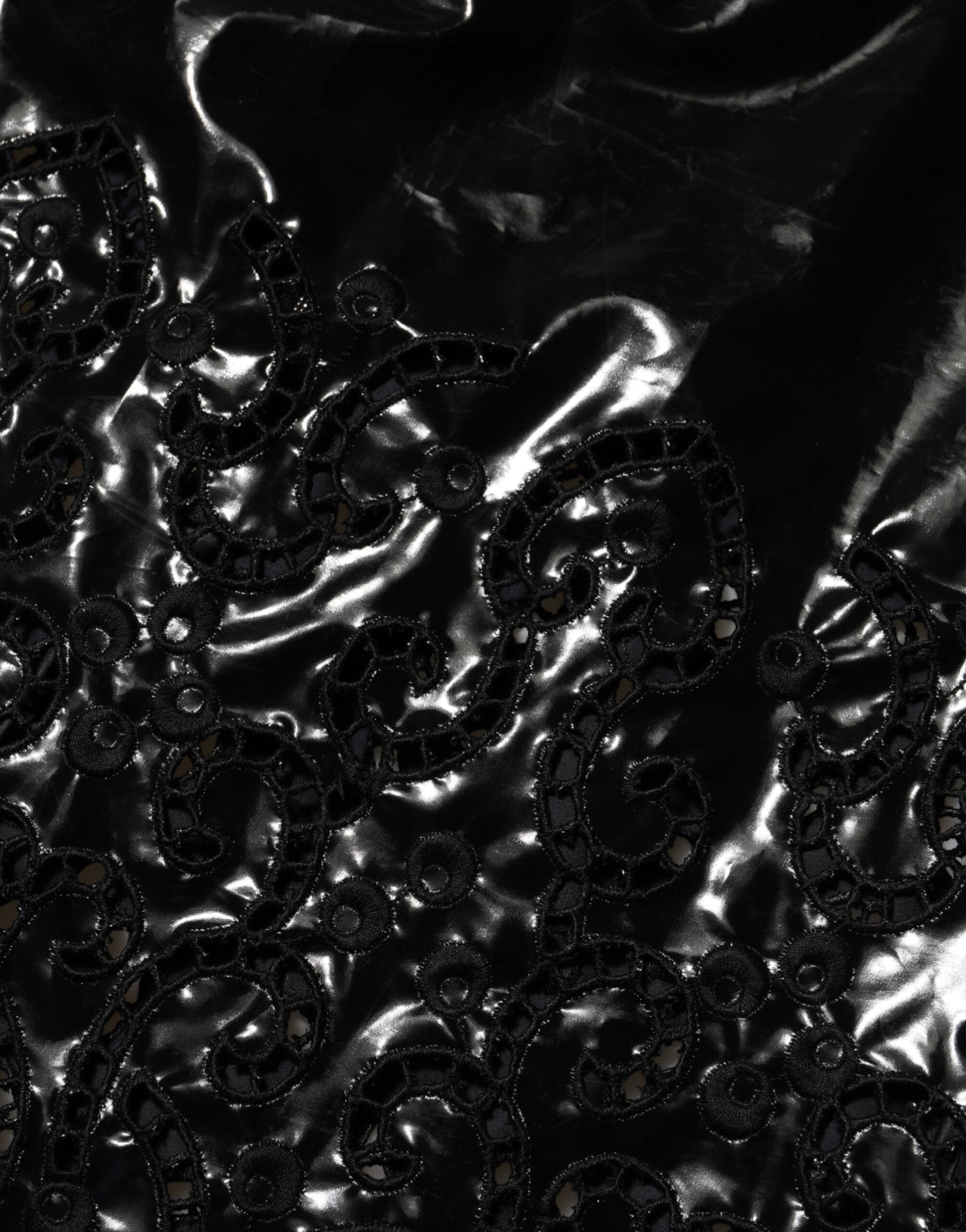 A black cut out A-line mini dress with sequin embellishments