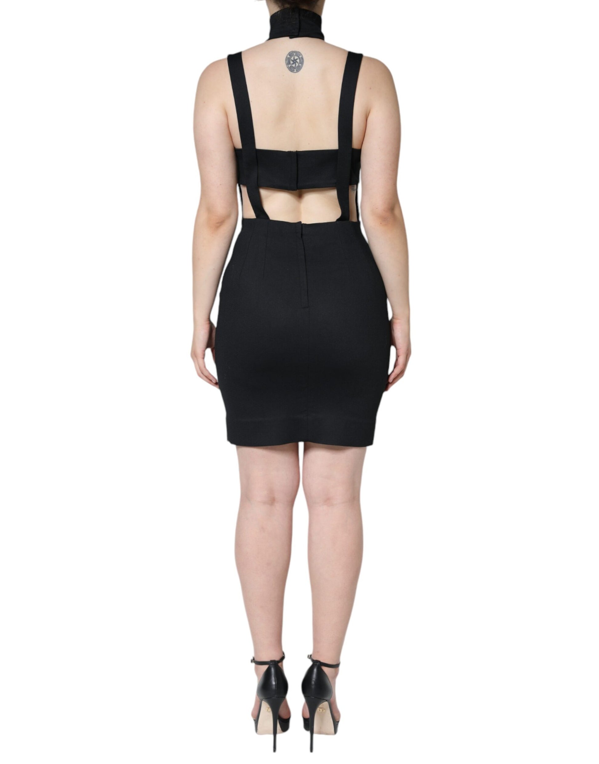 A black cut-out sleeveless bodycon mini dress with a high neckline and backless design