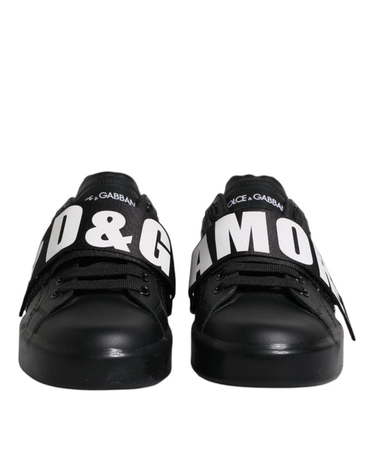 Pair of black sneakers with white lettering on sides