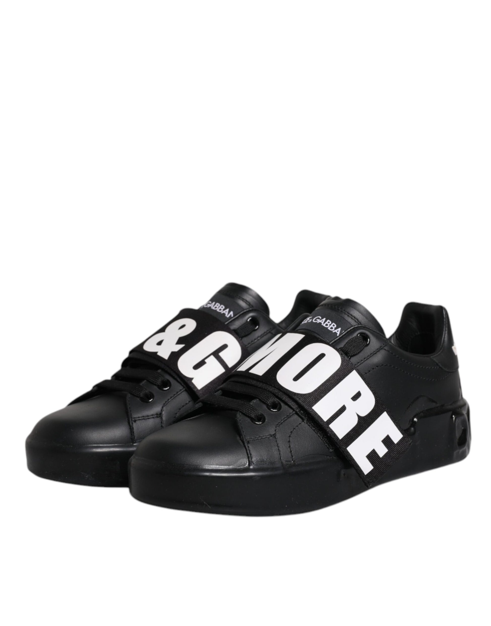 Pair of black sneakers with white text on side reading GIVE MORE