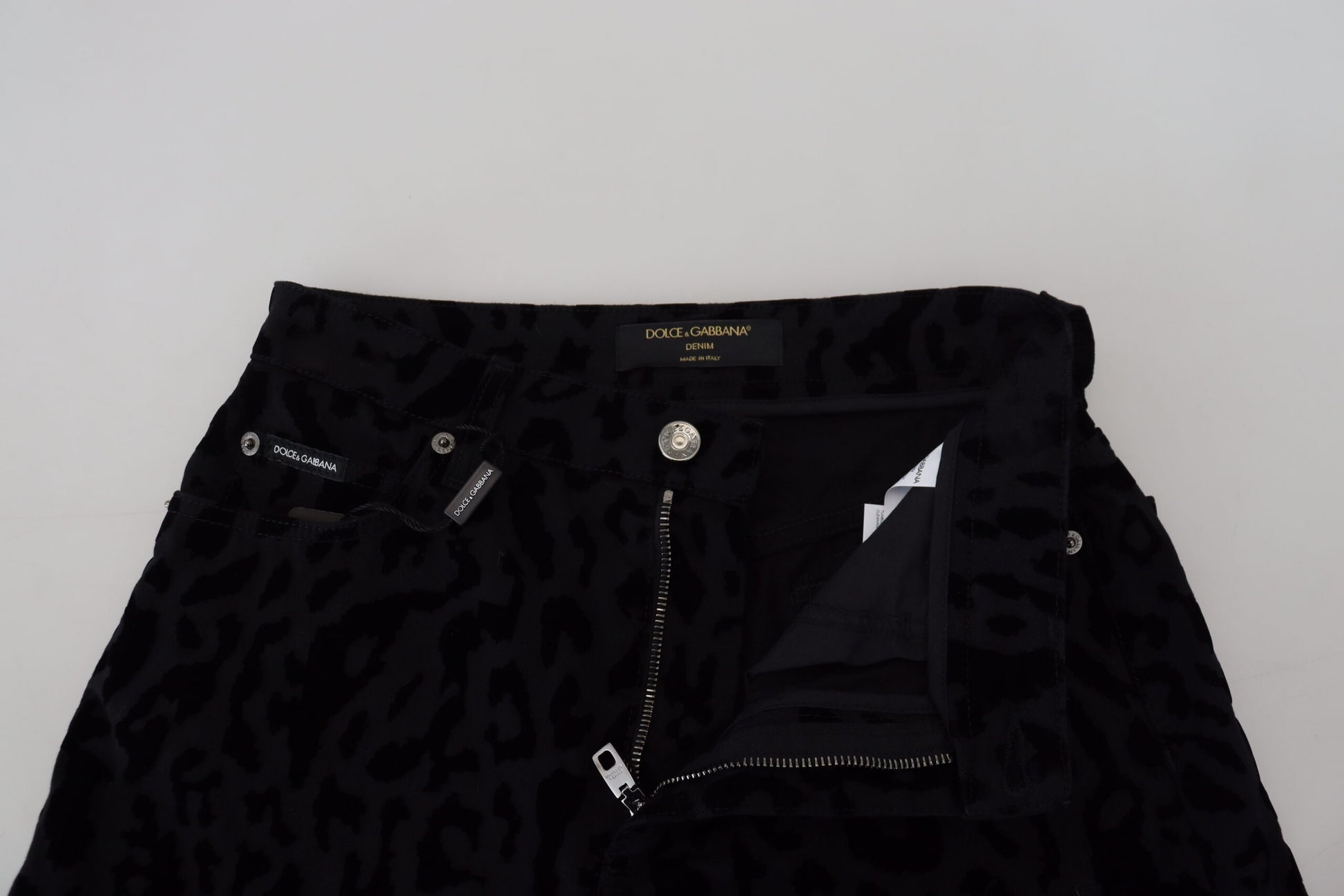 Black leopard print jeans with zippered pockets