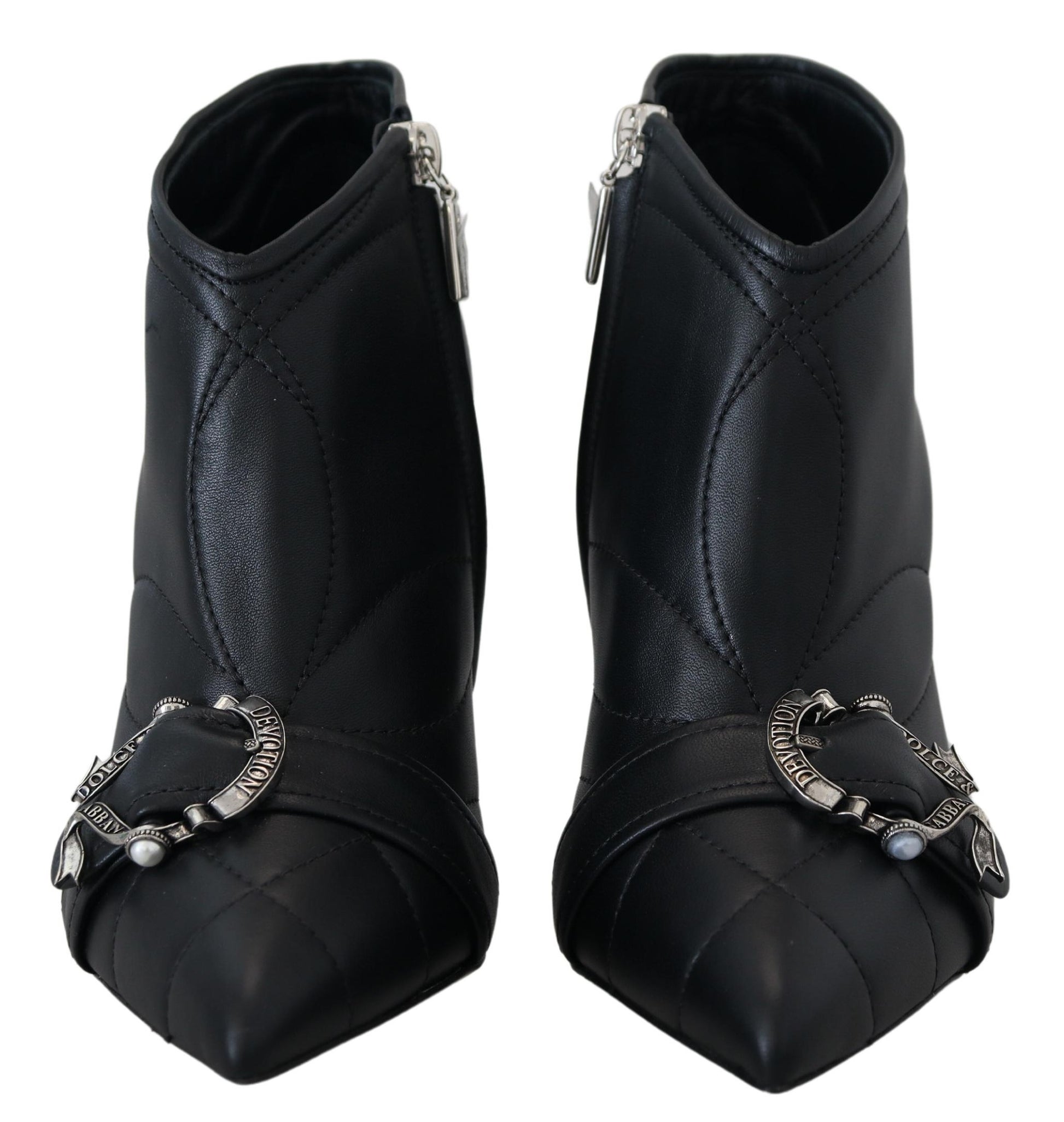 Pair of black leather boots with silver buckles and straps