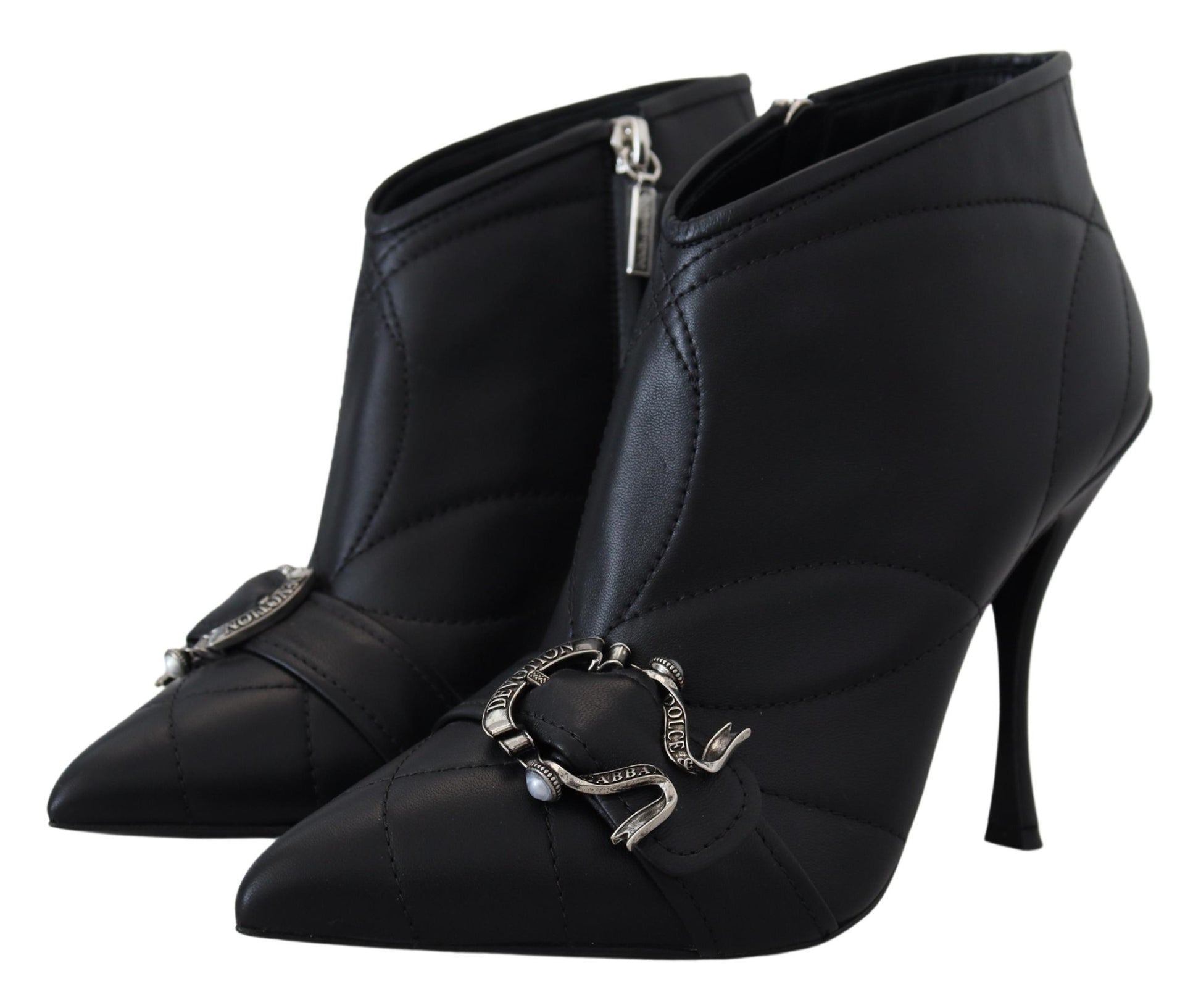Pair of black leather boots with silver buckles and straps