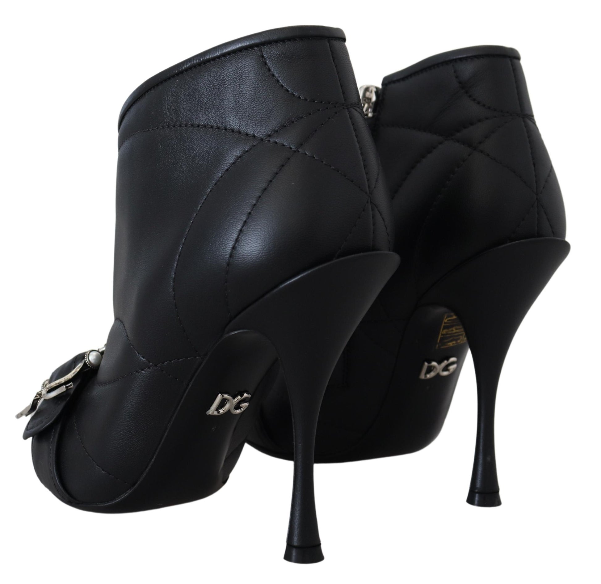 Pair of black high heel shoes with stiletto heels and a zipper on the side